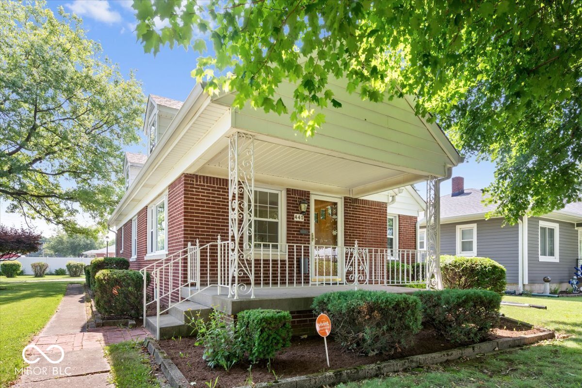 Step back in time and discover the charm and craftmanship of this well loved full brick home, owned by the same family since it was built. While it may need some updates, it has been well maintained, offering a rock-solid foundation. Inside you'll find original hardwood floors, built in China cabinet, and the kind of construction you don't see anymore. The upstairs area provides many options, large enough for several beds, large walk in closet, and has potential for a half bath. The windows on the main were replaced with double hang vinyl windows. Gas furnace and A/C replaced in 2013. The hardwoods and wood work are in excellent condition. Heading down into the basement, you'll find a second kitchen, great for entertaining space as well as options of creating more living space. Plenty of storage. The pool/ping pong table stays. 2 Car detached garage. Property being sold "AS IS".