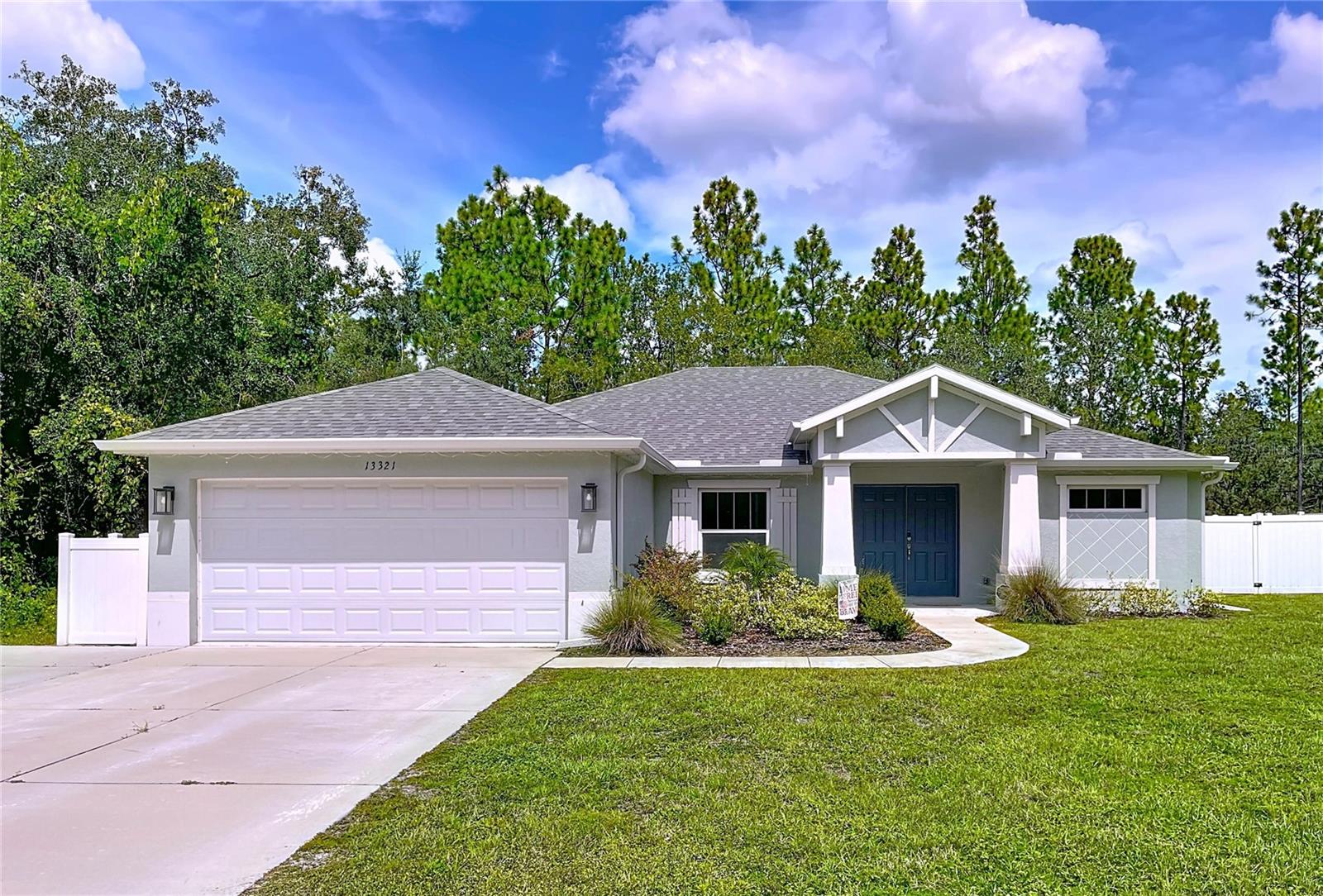 Welcome to your personal oasis in the heart of Hernando County! This stunning single-family 3 bedroom, 2 bathroom and bonus room home is nestled in the peaceful, rolling countryside, offering a perfect blend of comfort, privacy, and convenience. Whether you’re looking for a tranquil retreat or a vibrant family hub, this property checks all the boxes.
Step inside to discover a spacious open-concept living and dining area, accentuated by vaulted ceilings and an abundance of natural light – a perfect setting for family gatherings or cozy evenings at home. The heart of the home, the kitchen, boasts elegant wood cabinetry, solid countertops, a delightful breakfast bar, and a pantry ready to house your culinary treasures.

Retreat to the primary suite, a sanctuary featuring a generous walk-in closet and a luxurious en-suite bath complete with dual vanities and a step-in shower – ideal for unwinding after a long day. The split-bedroom floor plan offers privacy for everyone, making it a perfect layout for families, guests, or home offices.

The property also includes an attached 2-car garage with laundry hookups and ample storage space, making day-to-day living a breeze.

Outside, the expansive lot welcomes your imagination! Create your dream garden, set up a play area, or establish a cozy spot for your RV or boat. The private backyard, adorned with mature trees, beckons you to enjoy outdoor living and entertain friends and family in a serene setting.

Adventure awaits just minutes away! Explore the wonders of Weeki Wachee Springs or set sail from Hernando Beach with convenient Gulf of Mexico boat ramps nearby. For the outdoor enthusiast, the surrounding lakes, rivers, and conservation areas offer unlimited opportunities for kayaking, fishing, and hiking.

This home is perfectly positioned in the quiet residential area of Brooksville’s Royal Highlands region. Enjoy easy access to US-19 and the Suncoast Parkway for seamless commutes to Tampa and Clearwater. Additionally, you’re just moments away from shopping, dining, and medical centers in Brooksville and Spring Hill. Nature lovers will appreciate the proximity to the Chassahowitzka Wildlife Management Area and the breathtaking Withlacoochee State Forest.

This well-maintained home is move-in ready and offers a blank canvas for updates and personalization to make it truly yours. Don’t miss out on this incredible opportunity to own a piece of paradise!

This charming home in Brooksville is ready to welcome its new owner. Contact us to schedule your private tour and seize the chance to embrace a lifestyle of comfort, adventure, and tranquility!