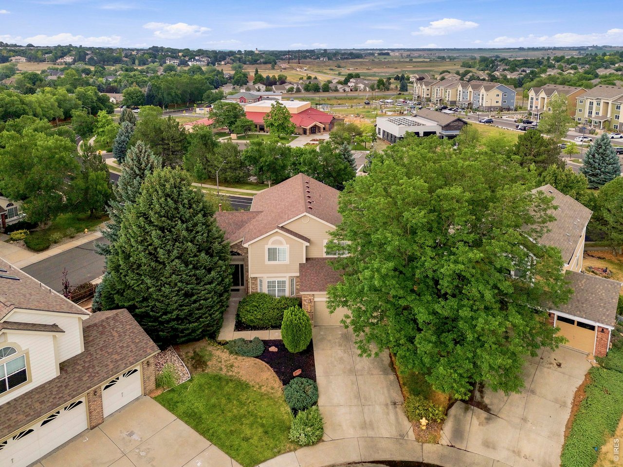 Perched on an elevated corner lot at the end of a quiet cul-de-sac in the highly sought-after Brittany Knolls neighborhood of South Fort Collins, this beautifully updated 5-bedroom, 4-bathroom home offers sweeping neighborhood views, exceptional entertaining spaces, and the Colorado lifestyle you've been waiting for. Begin your mornings with coffee on the spacious elevated deck while enjoying peaceful views, then unwind with Colorado's spectacular sunsets. The thoughtfully designed backyard features terraced landscaping, multiple outdoor living areas, an elevated deck, and a walk-out basement, creating the perfect setting for entertaining or everyday living. Neighborhood sidewalks are just steps away for evening walks, morning jogs, and connecting with neighbors. Situated on approximately 0.23 acres, the property showcases timeless architecture, mature landscaping, outstanding curb appeal, and a low-maintenance yard. Fresh interior paint gives the home a bright, refreshed feel. Inside, soaring vaulted ceilings, abundant natural light, and an open floor plan create a warm and inviting atmosphere. The living room, formal dining area, and family room flow seamlessly together, making the home ideal for everyday living and entertaining.The professionally finished walk-out basement is a standout feature, offering exceptional flexibility with a custom curved bar, private home theater, spacious recreation area, bedroom, full bath, and direct outdoor access. Whether you're hosting movie nights, entertaining guests, creating a private retreat for extended family, or designing a dedicated guest suite, this versatile lower level offers endless possibilities.Ideally located just minutes from Fossil Creek Park, Southridge Golf Course, scenic trails, shopping, dining, and top-rated Poudre schools, this exceptional home offers the perfect balance of peaceful neighborhood living and everyday convenience.