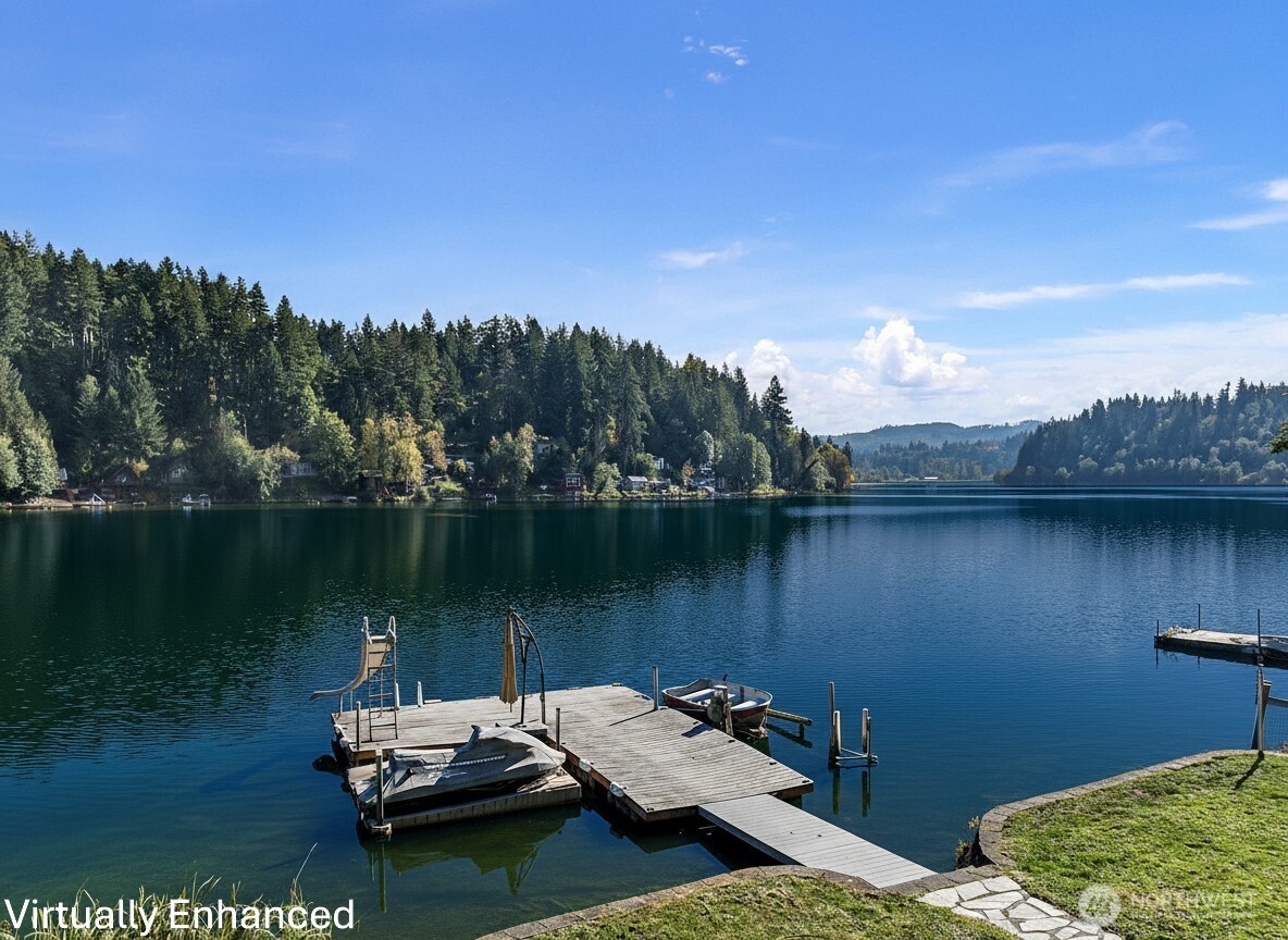 Escape to lake life at this beautiful waterfront retreat on Ohop Lake, minutes from downtown Eatonville. This 2BR home also has an outbuilding w/storage as well as a fun loft that can be used for game room or extra BR. Enjoy stunning views, a private dock, & easy access for boating, fishing, and swimming right from your backyard. The inviting cabin features an open-concept living area, a kitchen w/granite counters, wood cabinetry & warm interiors with natural trim throughout. Step out onto the large deck overlooking the lake-perfect for morning coffee at sunrise while watching bald eagles.  Amazing community w/gorgeous annual 4th of July fireworks display & fun group activities. This peaceful lakefront gem offers the ultimate PNW lifestyle.