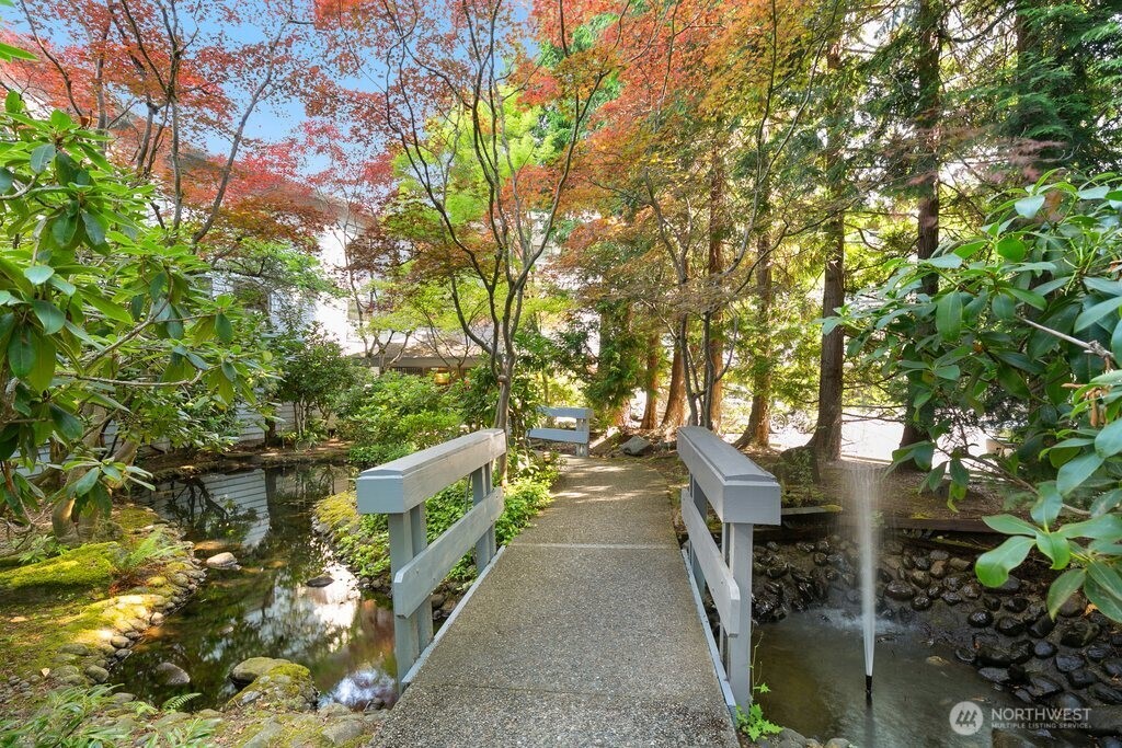 Walk to everything downtown Mercer Island—including shopping, dining, parks, and the upcoming light rail station—from this top-floor, light-filled end unit! Soaring vaulted ceilings and large windows create a bright and open feel throughout. Enjoy a spacious layout with a seamless flow between the living and dining areas, plus balconies off both the living room and primary suite for relaxing outdoor space. The updated ductless air conditioning system ensures year-round comfort. Two generously sized bedrooms, in-unit laundry, and two dedicated parking spaces add convenience to this well-appointed home. A perfect blend of location, comfort, and lifestyle in the heart of Mercer Island!