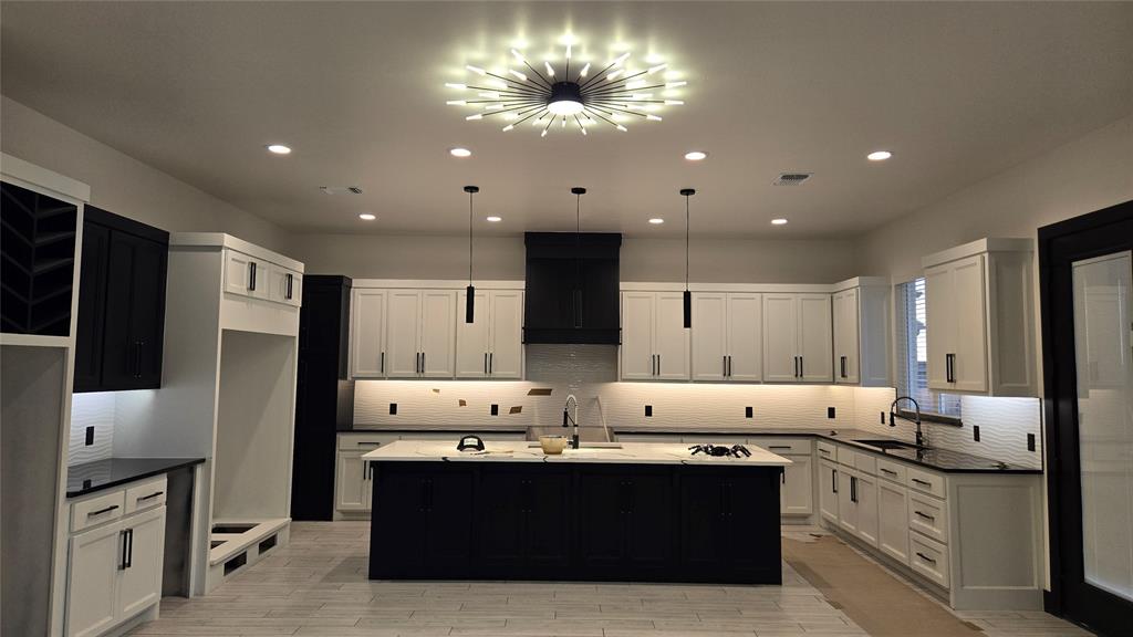 This exceptional new upscale modern design home offers a blend of luxury and functionality, featuring: Custom Cabinets: Tailored cabinetry that enhances both style and storage along with a study.
• Forno Appliances: Equipped with Forno's Italian-inspired, professional-grade appliances, the kitchen.
• Space-Saver Microwave: A built-in microwave designed.
• Granite or Marble Countertops with Backsplash: High-quality stone countertops complemented by a matching backsplash, offering durability and timeless beauty.
• Garage Door Opener with Keypad: An automated garage door system featuring a convenient keypad entry.
• 2" Blinds on All Windows (Excluding Obscured Glass)
• High-Efficiency 16 SEER Central Air-Conditioning: A 16 SEER central air-conditioning system that provides superior comfort and energy efficiency, ensuring a cool and comfortable living environment.
• Fully Sodded Yard: A professionally landscaped yard with lush sod, creating an inviting outdoor space ready for enjoyment. Along with covered patio so you can enjoy mornings or evenings comfortability. 
• Retractable Backdoor: A retractable backdoor that seamlessly connects indoor and outdoor living areas, perfect for entertaining and enjoying the outdoors.
• Electric Fireplace: A modern electric fireplace that adds warmth and ambiance to the living space without the maintenance of traditional wood-burning options.
• Exhaust Vent to the Exterior: An exhaust system that directs air outside, maintaining indoor air quality and comfort. This home is thoughtfully designed to offer a harmonious blend of luxury, functionality, and modern living. Home is just minutes of I-35 or going East to I-240. Community has a pool and recreational center.
***In your home before Thanksgiving!!!