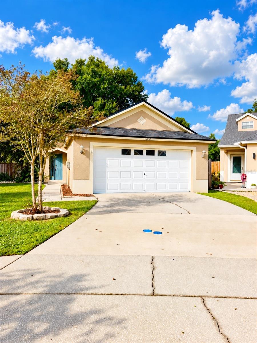 NEW ROOF. NEW FLOORING. FRESH PAINT. Your next chapter starts here! Tucked away on a cul-de-sac in a gated Wesley Chapel community, this refreshed home combines big-ticket updates with a location that puts everyday conveniences within easy reach. A newer A/C and water heater add to the appeal, while the freshly updated interior creates a welcoming feel from the moment you step inside.Enjoy a fully fenced backyard with room to relax, entertain, and make the most of Florida living. This tucked-away neighborhood is a hidden gem, close to shopping, dining, recreation, and major roadways.Conveniently located near I-75, the YMCA, The Hub at Lexington, KRATE at The Grove, Saddlebrook golf, and Tampa Premium Outlets, you’ll have plenty of options for getting out and enjoying Wesley Chapel.Why take on a project when so much has already been done? Schedule your private showing and see this home for yourself!