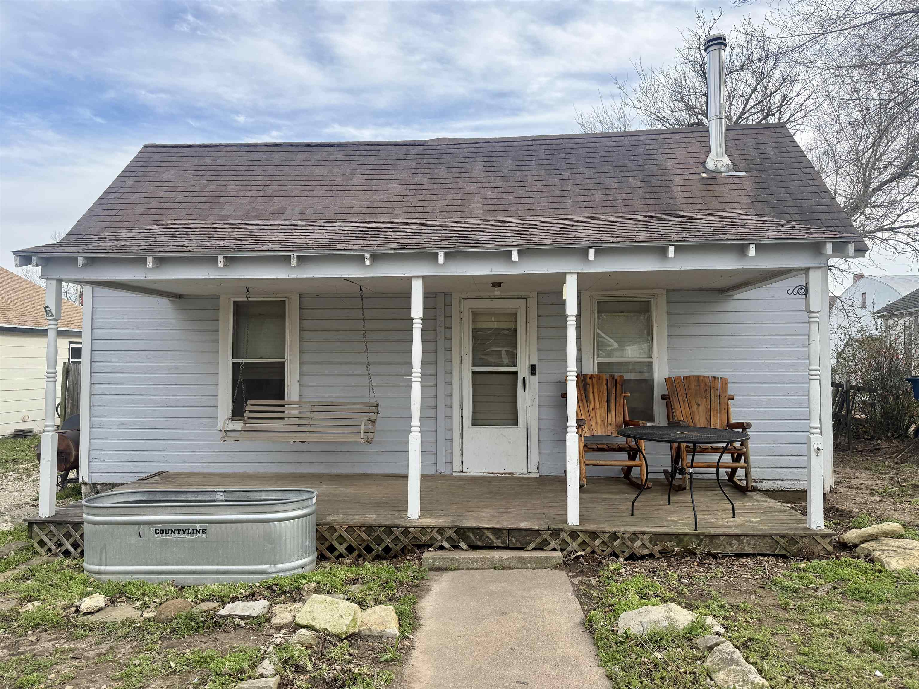 Cozy 2-bedroom, 1-bath home offering the comfort of small-town living at an unbeatable value! This property features a detached 1-car garage and has seen some major updates, including an entirely new plumbing system connected to the city main line and a complete electrical rewire with new service. A new hot water tank adds peace of mind, and a window A/C unit will remain with the home. While the central air unit does need replacement and finishing touches are still needed, this home is full of potential and priced accordingly.  A fantastic opportunity for investors or buyers looking to build equity!  All Appliances Transfer to new owners!