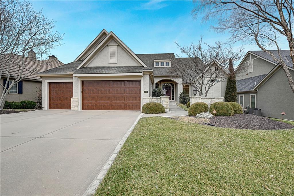 Welcome to this stunning reverse 1.5-story home nestled in a sought-after gated community of Loch Lloyd, perfectly situated on a beautiful wooded lot. Offering 3 spacious bedrooms plus a private office, this home blends elegance, comfort, and functionality. Main level features an open and inviting layout with abundant natural light and serene views. The kitchen flows seamlessly to a screened-in porch — the perfect spot to enjoy morning coffee or unwind while overlooking the peaceful backyard setting. Lower Level is designed for entertaining and everyday living, featuring a large recreational space complete with a bar area, an additional bedroom, and plenty of storage. Step outside to the lower-level patio and enjoy the meticulously maintained landscaping that surrounds the home, creating a private outdoor retreat. With its thoughtful layout, scenic lot, and exceptional indoor and outdoor living spaces, this home truly offers the best of comfort and style.