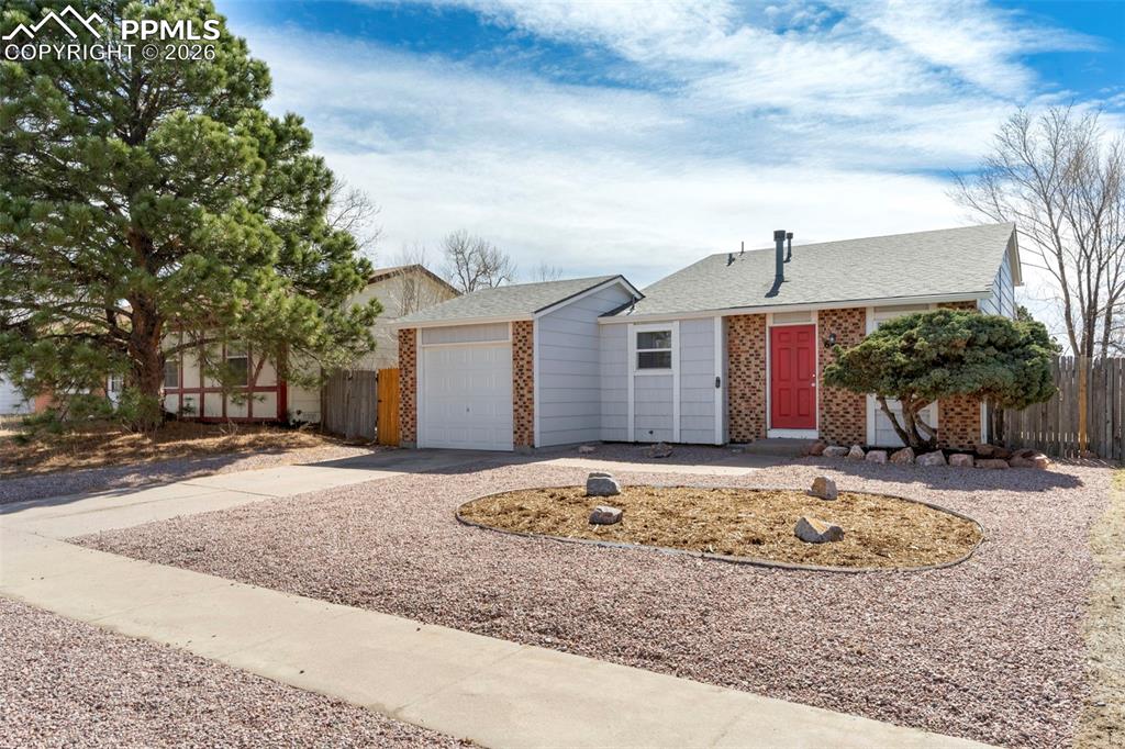 Charming split-level home featuring 2 bedrooms, 1 bathroom, and a 1-car garage. The main level offers a comfortable living room, dining area, and kitchen with updated appliances. The lower level includes a spacious family room and a utility room with washer and dryer hookups. The bathroom has been updated. Enjoy the fully fenced backyard—perfect for relaxing or entertaining. Located in desirable D-11 school district.