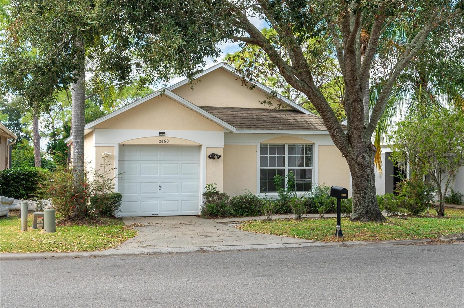 3 Bedroom, 2 Bathroom Home with a Pool - Overlooking Golf Course.  Enjoy Florida Living at its finest in this beautiful 3 bedroom 2 bathroom  home with a screened pool and spacious deck.  The open-concept layout seamlessly connects the kitchen and living areas, featuring a kitchen island with seating--perfect for entertaining or family gatherings.  Relax while taking a serene golf course views through sliding glass doors that lead out to the pool area. The master bedroom is generouly sized with an en suite and walk-in closet, and the additional bedrooms are spacious and and comfortable. Located in the presitgious Southern Dunes Golf & Country Club, residents enjoy 24-hour security, tennis courts, a clubhouse, community pool and a fitness center.  Just a short drive to Tampa or Orlando attractions, shopping, airports and nearby beaches, this home offers the perfect blend of convenience and luxury.  Schedule your showing today--this a a great place to call home