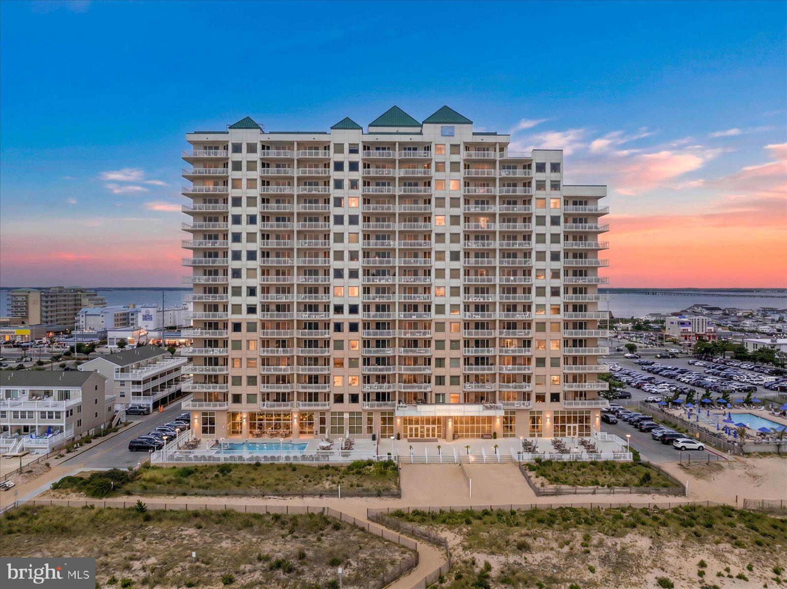 2 48th Street, Unit 510 — Ocean City, MD3 BR | 3 BA | Direct Oceanfront at Gateway Grand | Sold FurnishedWake up to the Atlantic, walk out to the living room, and see it again. The primary bedroom and the main living space are both east-facing, each opening to the covered balcony that runs the ocean side of the unit. Fifth floor — high enough for a clean horizon over the dunes, low enough to still pick out the people on the sand.The primary is a true oceanfront suite: a king sits under a picture window of open water, with a slider to the balcony right beside it. Its bath has a double granite vanity, a glass walk-in shower, and a separate jetted tub set into the marble-look tile.The kitchen runs open to the dining and living space, so whoever's cooking is still in the conversation and still in the view. Granite counters, stainless appliances, and a center island with bar seating on one side and a built-in beverage fridge on the other. The dining table seats the whole group with the water over your shoulder.Two more bedrooms sit at the entry end of the unit, set back from the open living space so they stay quiet when the great room fills up. One has a queen and a private ensuite; the other is set up with a twin-over-full bunk. Three full baths in all. Full-size washer and dryer in their own room, not a stacked closet.Sold furnished, down to the beds and the kitchen. Nine-foot ceilings and crown molding, nearly 1,790 square feet, all on one level.THE BUILDING — Gateway GrandGateway Grand is the premier oceanfront building in Ocean City. One of the tallest towers on the beach, fronting 250 feet of private sand at 48th Street. The lobby is a full oceanfront room with floor-to-ceiling glass, a club lounge, an owners' lounge, and direct access to a private terrace over the beach. Indoor and outdoor pools, a hot tub on the oceanfront sun deck, and a fitness center that looks straight out at the Atlantic. Covered garage parking with EV charging, individual beach-gear storage, a kids' game room, concierge, and on-site management. The monthly fee covers water, cable, building insurance, trash, and the pools. Pets welcome within the association's limits.THE LOCATION — 48th Street, Midtown OCDirect oceanfront — the beach is out the back of the building, no crossing Coastal Highway to reach the sand. Seacrets is a block west on the bay; Fager's Island is a few blocks north. Midtown puts you between the quiet north end and the downtown boardwalk, close to the 45th Street shops and dining without the downtown traffic. BeachLife Gateway Grand!