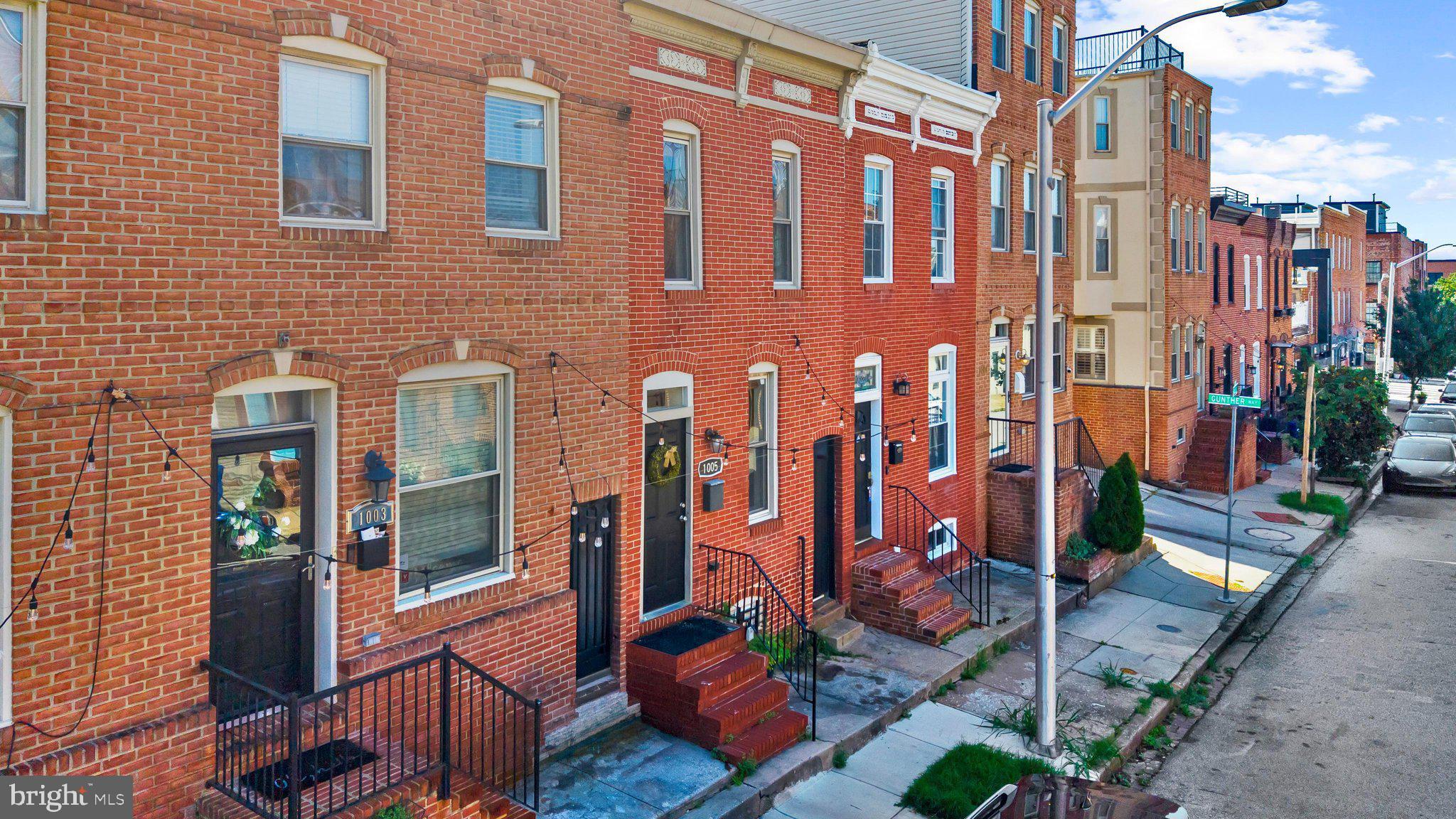 Available for immediate rent, 1005 Baylis Street is a charming 2-bedroom, 1-bath Federal-style brick townhouse in the heart of Canton, just one block from O’Donnell Street and close to Canton Crossing, the waterfront, Canton Square, Brewers Hill, local dining, shopping, parks, and neighborhood amenities. Built in 1910 and thoughtfully updated, this inviting home blends classic character with modern conveniences, featuring an open living and dining layout, real hardwood floors, fresh paint, recessed lighting, a skylight, and great natural light throughout. The kitchen offers solid wood cabinetry, granite countertops, stainless-steel appliances, a gas range, built-in microwave, dishwasher, and space for casual dining. Upstairs, two comfortable bedrooms and a full bath with a whirlpool tub provide a relaxing retreat. Enjoy multiple outdoor spaces, including a fenced backyard, a second-floor deck, and spiral stairs leading to a rooftop deck with city views—perfect for entertaining, dining outside, or unwinding at the end of the day. With on-street parking, low-maintenance living, and excellent access to commuter routes and all that Canton has to offer, this home is a wonderful opportunity to enjoy Baltimore city living. Also available for sale. See MDBA2226868.