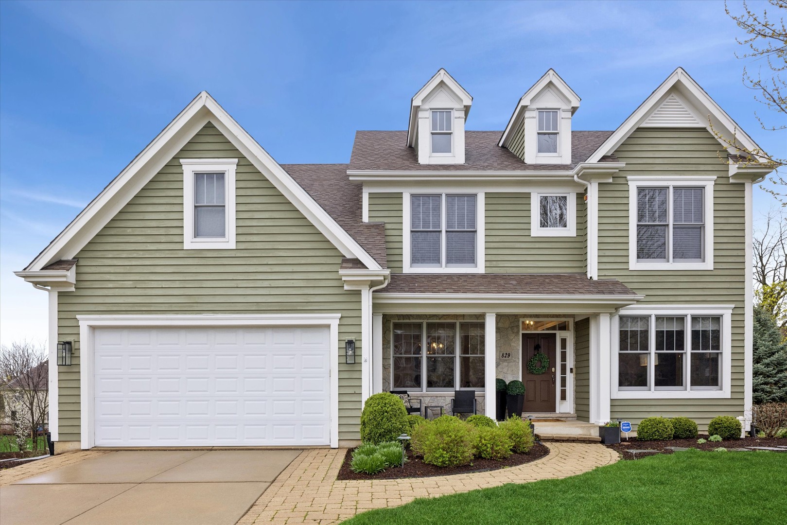Tucked on a quiet cul-de-sac in a sought-after Glen Ellyn neighborhood, this beautifully maintained home offers timeless appeal and a functional layout designed for everyday living. Sun-filled interiors, highlighted by a dramatic two-story family room with fireplace, create a warm yet impressive focal point. Thoughtfully designed spaces include a dedicated home office, formal dining area, and expansive living areas ideal for both entertaining and daily life.    Offering approximately 3,381 square feet, this 4-bedroom, 4.1-bath residence also features a finished walkout basement with full bath, providing additional flexible living space. Enjoy outdoor living in the spacious backyard complete with a newer patio (2021) and Trex deck (2021). Additional highlights include a 2-car attached garage and close proximity to parks, schools, Downtown Glen Ellyn, and Downtown Wheaton.    A fantastic opportunity to secure a move-in ready home in an exceptional location.