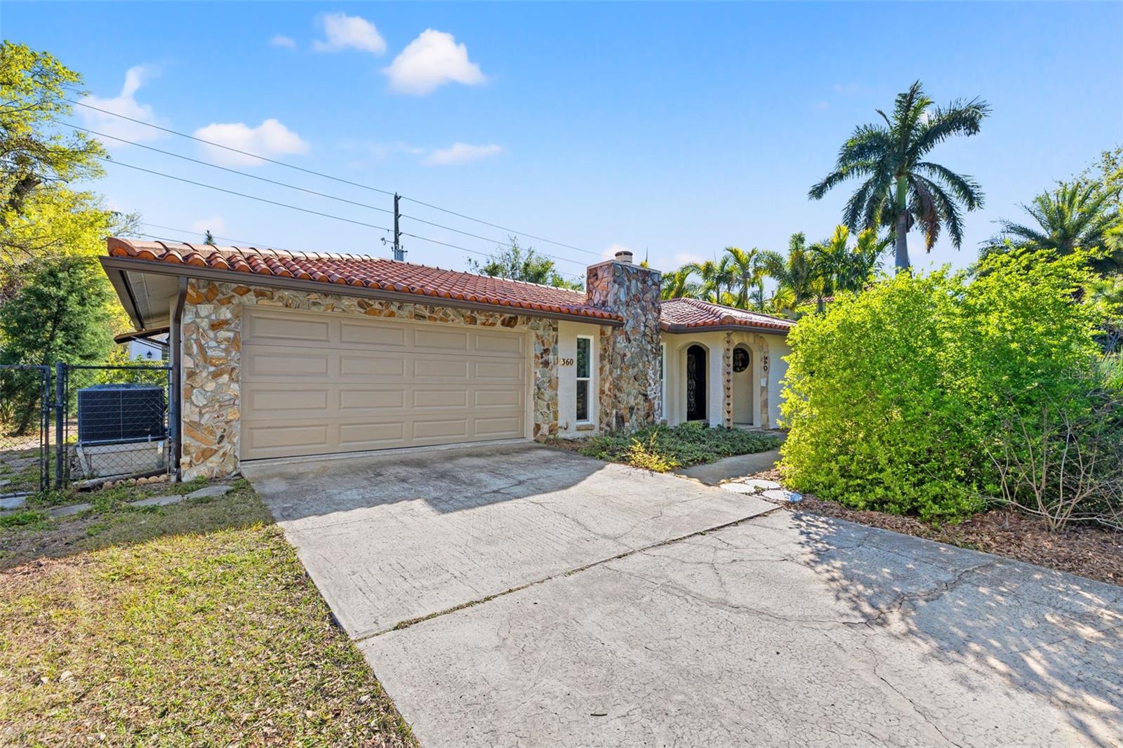 Welcome to this immaculate Custom-Built Home right in the heart of Old Northeast Coffee Pot Bayou. This beautiful block construction home is nestled on an oversized corner lot with an additional 8 feet to the sidewalk, this meticulously maintained custom-built beauty offers a rare combination of charm, modern updates, and stunning curb appeal. Boasting 1,554 square feet of thoughtfully designed living space, this 3-bedroom, 2-bathroom residence provides both comfort and functionality in one of St. Pete’s most sought-after locations. As you arrive, a large driveway welcomes you to this serene retreat. Step inside to discover polished concrete floors that enhance the home’s modern yet timeless appeal. The spacious living room is a true showstopper, featuring a wood-burning fireplace that adds warmth and character, while large hurricane-proof windows, installed in 2021, flood the space with natural light providing picturesque views. The updated kitchen (2019) is a chef’s dream, featuring granite countertops, Quartz center island, stainless steel appliances, a large center island, and custom wood cabinetry. Whether you're preparing a gourmet meal or entertaining guests, this space is as functional as it is beautiful. The adjacent dining area seamlessly connects to the open floor plan, creating an inviting atmosphere for gatherings. The primary suite is a private sanctuary, boasting a spacious layout, ample closet space, and a private ensuite bath with a walk-in shower. Two additional bedrooms provide flexibility for family, guests, or a home office, while the home’s original vintage bathrooms add a touch of character and nostalgia. Outdoor living is just as impressive. A screened lanai provides the perfect spot for morning coffee or evening relaxation, while the private backyard—complete with alley access and remarkable native drought site tolerant landscaping offers endless possibilities for entertaining, gardening, or even expansion. The oversized two-car garage includes a workshop, additional storage, and a utility sink, complemented by an additional carport for even more covered parking. Beyond the home’s incredible features, its prime location sets it apart. Steps away from Coffee Pot Bayou, enjoy scenic walks, paddle boarding, and breathtaking sunsets. The home is centrally located with easy access to Beach Drive, downtown St. Pete, and exclusive shopping and dining. Notable upgrades include: New HVAC system (2020) Hurricane-proof windows (2021) Clay tile roof for durability and style, New water heater (2024) This is an exceptional opportunity to own a custom home with water view, modern updates and a coveted location in one of St. Pete’s most desirable neighborhoods. Schedule your private tour today and experience the charm, elegance, and convenience of this truly amazing property.