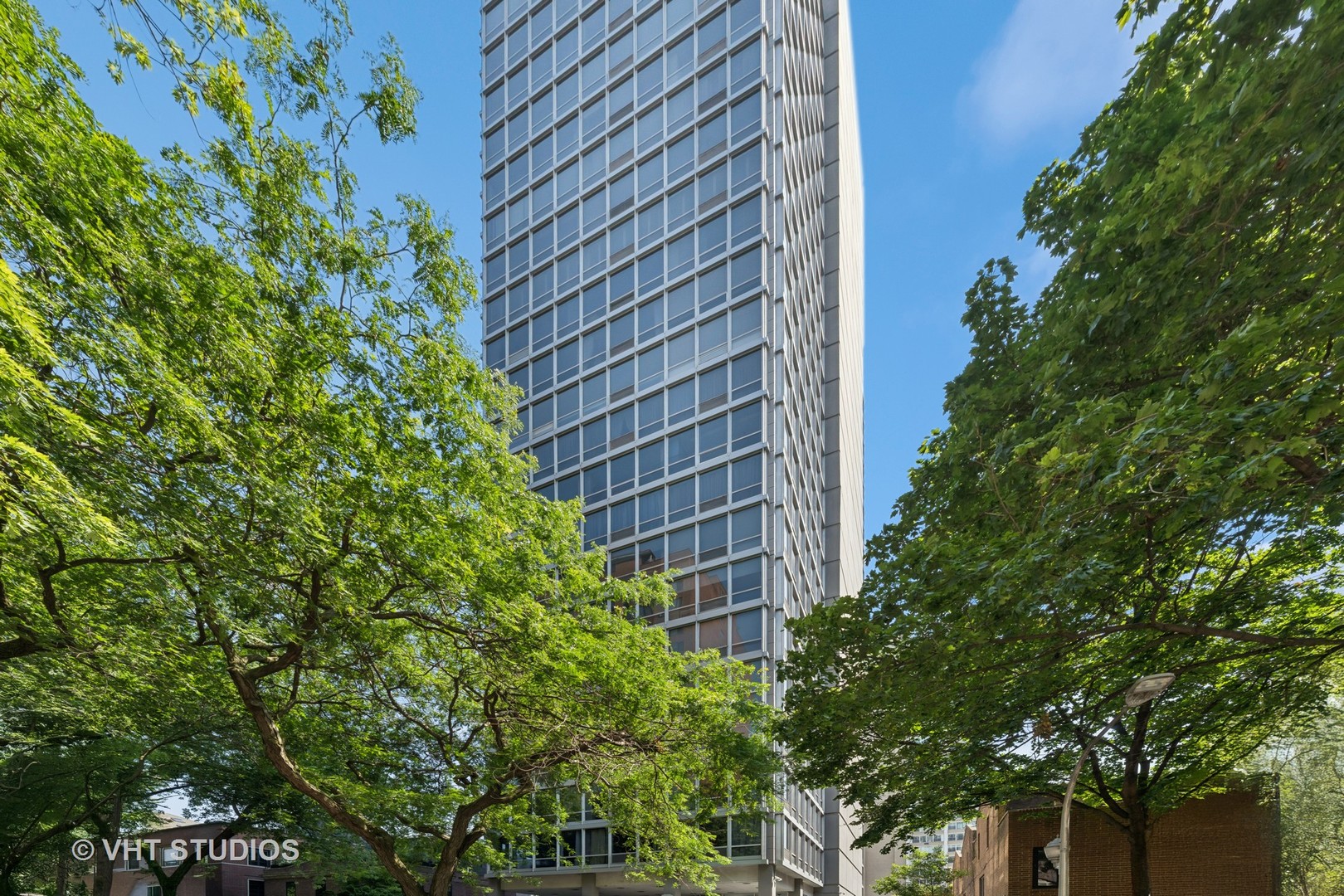 Fully Renovated 2,600 sq ft 4bdr/3ba/+office one of a kind home by Inner LSD in popular East Lakeview. Gorgeous floor-to-ceiling windows throughout give incredible light with views of Lincoln Park, tree tops, and neighboring mansions, complete with two large balconies for outdoor grilling enjoyment. 339 Barry is an elegant, architecturally significant, boutique Mid-Century Modern building in the style of Mies van der Rohe surrounded by 100 year old mansions East of Sheridan Rd. The home is thoughtfully designed throughout, blending mid-century architecture with today's luxury finishes. The enormous South and East facing Living and Dining area open onto a sleek brand new open concept Kitchen showcasing quartz countertops, Kitchen Aid stainless steel appliance suite, and ample white cabinetry. The opposite side of the unit features an equally large Family Room with open access to the largest of the two balconies. The enormous Primary Bedroom and Dressing Room with Ensuite Bath is located in the South and West facing corner. Two additional oversize Bedrooms, a smaller 4th bedroom, a home office with its own light and bright windows, and two additional full baths complete the picture. All three baths are outfitted with matching vanities, quartz countertops, and Kelly Werstler lighting. The home features many closets, including two truly enormous in-unit storage spaces. This full-service building includes door staff and an on-site engineer, offering worry-free living and lock-it-and-leave-it convenience in one of Chicago's most desirable lakeside neighborhoods. 339 Barry is steps from the lake, parks, golf range, tunnel to the lakeside at Barry & Lincoln Park, marinas, outdoor dining, shops, and steps to express buses to take you the short distance to Michigan Avenue, Millenium Park and Downtown. Two waitlist parking spaces included. Monthly assessment amount per square foot is lower than usual for any lakeside neighborhood Chicago highrise. Enjoy all of this at a fabulously common-sense price! Pets welcome!!!