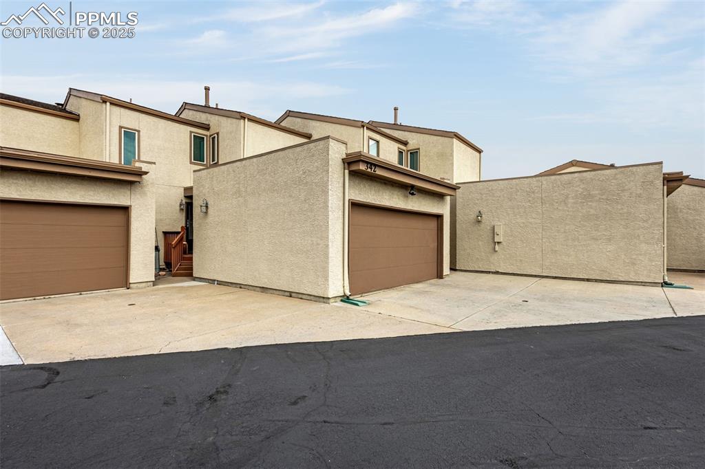 Location, open space, and Pikes Peak views all in D20 Gleneagle! This beautiful, updated home has many upgrades including two new composite decks with mountain and greenspace views, new carpet and interior paint, updated can lighting, bedroom ceiling fans, vinyl windows, a Radon mitigation system, and the HVAC and gas fireplace were serviced last month.  You will love the updated kitchen with abundant storage open to the dining area and living room with a gas fireplace. The dining area has a walkout to the main level composite deck with iron railing.

The primary and 2nd bedroom/office are on the second level each with their own private bathroom.  The primary bedroom has a large walk-in closet and its own private deck with mountain and open space views. The third bedroom is in the basement along with a game room/study, and another 3/4 bath. There is an attached two car garage and plenty of parking for guests. Complex is pet friendly (check HOA guidelines). The complex has beautiful xeriscaped common space with walking paths, park style benches, and picnic table. The open space out the back door is owned and maintained by the Gleneagle Civic Association, the HOA for the surrounding houses. The open space is over 100 acres with maintained trails available to walk, run, bike, & walk the dog on. Gleneagle townhomes are in the center of Gleneagle minutes away from the Academy and I-25. This is a unique opportunity to live in a beautiful turn-key townhome that backs to open space with unobstructed mountain views in quiet Gleneagle, a community that is close to all that Northgate and Monument have to offer with tons of shopping, restaurants, and entertainment right around the corner. Watch the Air Force Academy jets during graduation from your deck!