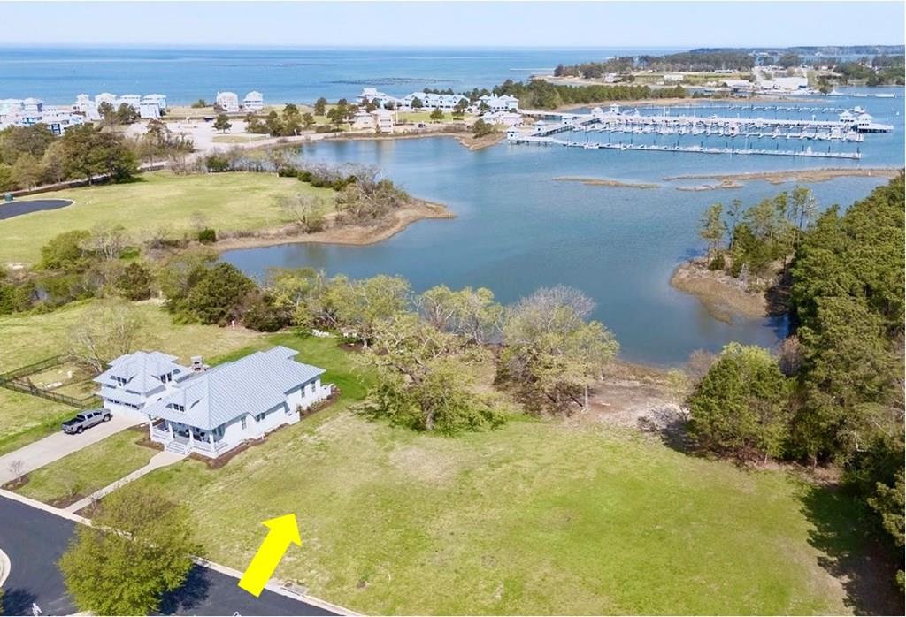 This Very Special Waterfront building lot in Bay Creek Golf Resort, overlooking the Cape Charles Marina is one of only a handful of lots like it! Enjoy marina views from sunrise to sunset as the boats sail out for daily adventures on the water. Watch the twinkling evening lights dancing on the water as you take in the cool coastal breezes off the Bay! Enjoy exceptional community amenities including over 2 miles of private beach, pool, tennis & pickleball courts and miles of scenic walking & biking trails. Optional membership provides access to the Arnold Palmer and Jack Nicklaus Signature 27-hole golf course, private beach club & fitness center. Hop in your golf cart & head into the charming town of Cape Charles for waterfront dining, boutique shopping, bakeries, galleries & much more!