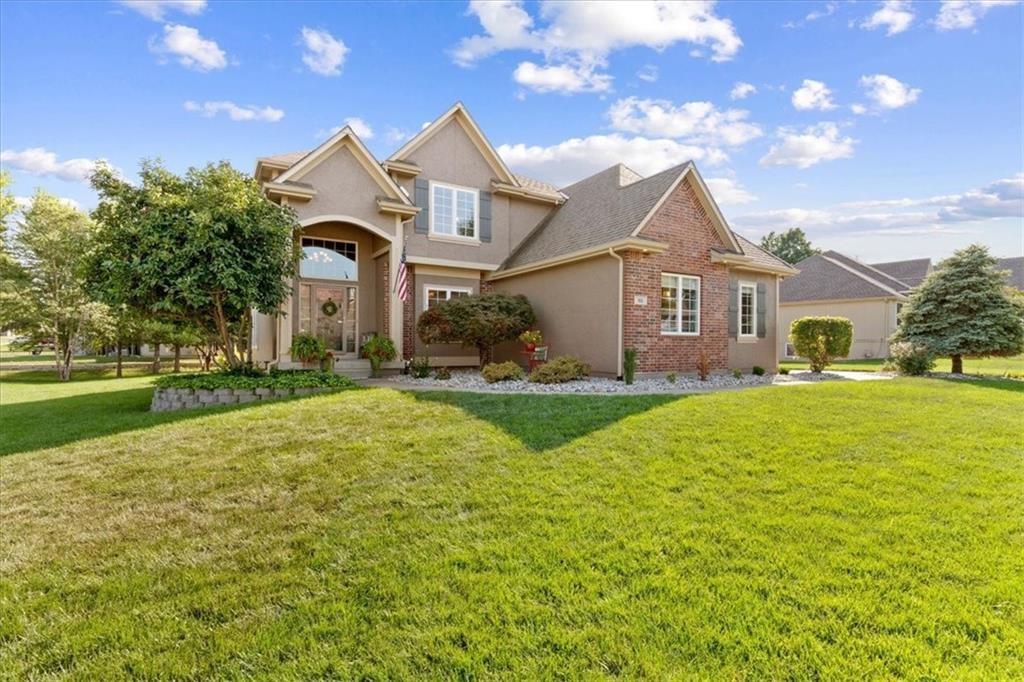 Beautiful 4 -bedroom, 4.5 bath Raintree Lake home nestled on a spacious .45-acre corner lot with gorgeous views from nearly every window. This exceptional property offers the perfect blend of comfort, elegance, and everyday resort-style living. The main level features a welcoming living room with breathtaking lake views, a spacious formal dining room, and a large kitchen with abundant counter space, pantry storage, and easy access to the screened-in porch--perfect for relaxing or entertaining. The laundry and mudroom are conveniently located just off the oversized 3-car side entry garage.  The primary suite is a true retreat, complete with a private deck overlooking the lake and pond, plus a spa-like bath with heated tile floors. An office with serene water views makes working from home feel like a getaway. The finished lower level adds incredible versatility with a full bath, second kitchen, large family room, and cozy hearth room ideal for guest, entertaining, or multi-generational living. Outside, the beautifully landscaped yard in enhanced by in-ground sprinklers, drip irrigation for a garden, and two fire pits-one gas and one wood-burning-creating the perfect setting to enjoy the peaceful surroundings. The indoor and outdoor living spaces make this Raintree Lake home a dream, you will feel like you are on vacation every day.