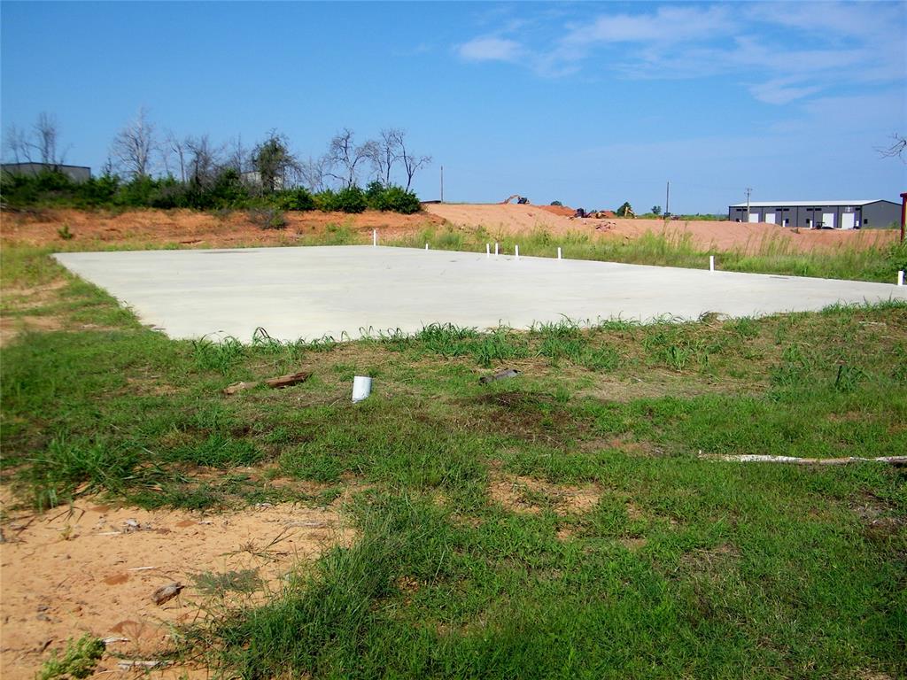 Newer industrial park that is growing and filling fast.  Here you will find a ready to build slab. There is 6,000 square feet (50x120) of 6 inch thick concrete with full rebar enforcement, all 6,000 square feet with metal plates to build on.  There is plenty of electricity available - 3 phase, 1,000 amp OG&E transformer on site.   This is a one acre lot in business friendly Koloa Industrial Park.  It is zoned industrial with no zoning requirements.  Utilities available include natural gas & fiber internet.  Located just minutes from I-35 make this an ideal location to start growing the business you have always wanted.  There is an assumable loan of $80,000 that can help with the purchase cost.  Call today to make this your own!