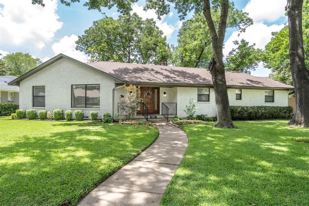 MOVE-IN READY LOCHWOOD CHARMER WITH RECENT MODERN UPDATES! Staged & ready for showings! Just 1.5 miles from White Rock Lake, this beautifully renovated 3-bedroom, 2.5-bath Lochwood home sits on one of the neighborhood’s most desirable tree-lined streets. Positioned on one of the largest lots, the gentle curve of the street creates a spacious front yard shaded by mature trees, offering both curb appeal and privacy. 
• Inside, the open-concept layout is filled with natural light and features refinished oak hardwoods, expansive Low-E windows with custom treatments, and a soft, neutral palette. The chef-inspired kitchen is the centerpiece of the home, boasting quartz countertops, a large island with breakfast bar, white cabinetry, and stainless steel appliances—including a five-burner gas double oven with convection and modern vent hood. The living and dining areas flow seamlessly, making entertaining effortless.
•The primary suite is a serene retreat with spa-like bath featuring frameless glass shower, double vanities, quartz counters, and oversized walk-in closet. Two additional bedrooms share a stylish dual-sink bath, while a powder room and separate laundry with sink add convenience.
•Step outside to a private backyard oasis with turf lawn, covered patio, mature trees, board-on-board cedar fencing, and full sprinkler system—perfect for year-round enjoyment.
•Extensive renovations from 2018 AND RECENTLY IN 2025 include: Trane 14 SEER HVAC, roof, gutters, resurfaced hardwoods, updated lighting, fresh Alabaster paint, landscaping, Chimney cap, Roofing, and a custom stained wood-and-glass front door with sidelights. An oversized 2-car garage completes the property.
•Located in one of East Dallas’s most walkable, nature-filled neighborhoods—close to parks, tennis courts, the Dallas Arboretum, Lakewood, Eateries and Downtown Arts and Northpark Mall—this move-in ready home is the perfect blend of comfort, character, and convenience. Don’t miss it! Motivated Seller!