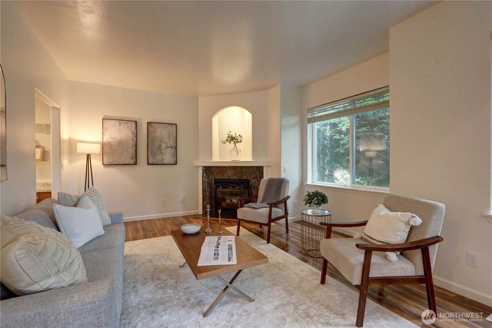 There are townhomes that offer space, and then there are townhomes that offer a better way to live. This beautifully designed residence does both, w/2,145 SF of light-filled living space, thoughtful updates, & an exceptional location.    Nestled within a private 4-unit community, this home combines comfort, convenience, & low-maintenance living. The formal dining room opens to a private balcony thru sliding glass doors, creating an inviting setting for entertaining. The kitchen features stainless appliances including a gas cooktop & a pass-through window to the dining area. A corner gas fireplace anchors the living room, while expansive windows fill the home w/natural light & showcase luxury vinyl plank flooring thru-out the main living areas.    Upstairs the spacious primary suite offers vaulted ceilings, a dual-sink vanity, soaking tub, separate shower, & walk-in closet, creating a true retreat. The lower level includes a dedicated laundry room w/utility sink & shelving, plus direct access to the patio & private yard w/raised garden beds.    Add’l highlights include an att’d 2-car garage, extra off-street parking, & low HOA dues.      Enjoy an unbeatable location w/Trader Joe’s, Safeway, Fred Meyer, & PCC all within walking distance. Convenient freeway access & proximity to the airport make commuting & travel effortless. All this just 20 min’s from downtown, for the perfect balance of privacy, accessibility, & everyday convenience.