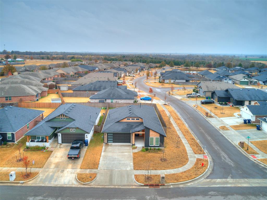 This gorgeous corner-lot home brings all the good vibes! Step inside to an open layout with tall ceilings and a covered patio that practically begs for summer hangouts. The kitchen is an entertainer’s dream—featuring a huge flat island with front-row views of the living room and breakfast nook, a large walk-in pantry, a gas range for serious cooking, and sleek quartz countertops that make everything look photo-ready.The main living areas have durable hard-surface flooring and a cozy fireplace that’s perfect for movie nights or chilly evenings. Every bedroom comes with a ceiling fan to keep things cool and comfortable. The primary suite is a true retreat with quartz double vanities, a large soaking tub, a tiled shower, and a walk-in closet big enough to celebrate.Out back, the covered patio with a built-in gas line makes grilling a breeze—literally. And with super-quick access to both I-35 and I-240, getting anywhere is a piece of cake.This home is stylish, inviting, and ready for someone who loves to live life comfortably and have a little fun along the way.