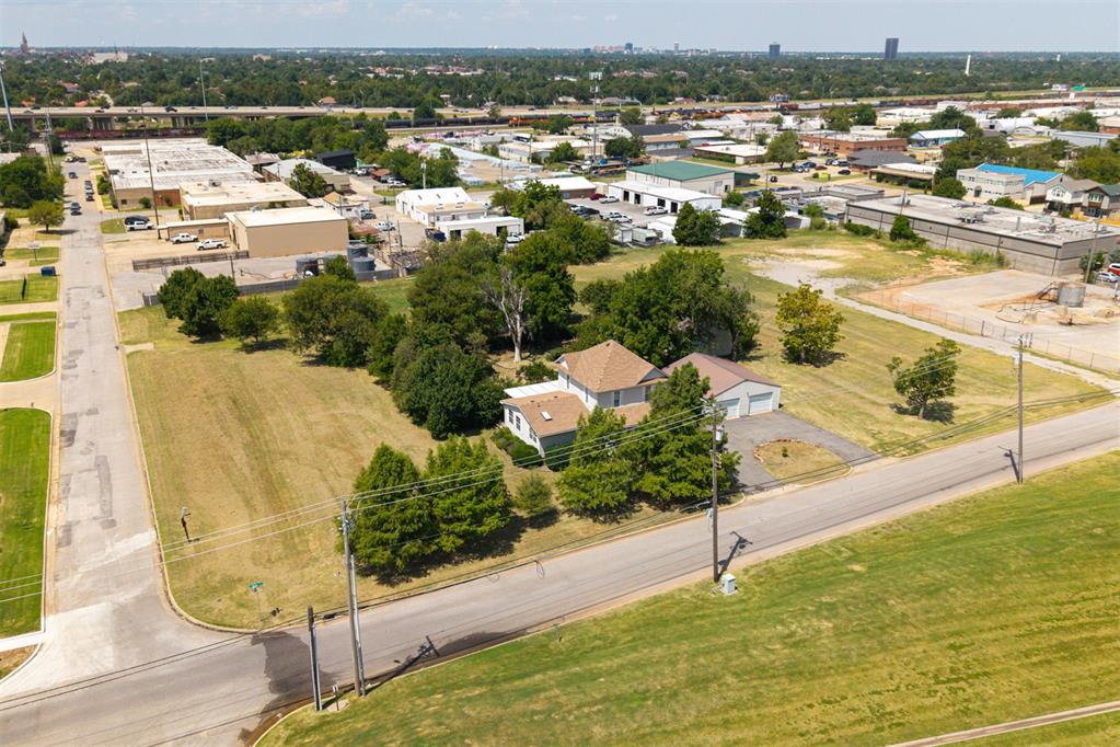 One of OKC's rarest 2.16 acre opportunities! Just blocks from the State Capitol and the growing Capitol/Medical District, Zoned R-1 single family, this property offers one of the largest remaining parcels in the area — a unique opportunity for those seeking a site with history, scale, and future potential. The property includes a 1910 farmhouse with garage and shop, both with electricity. While the home reflects the character of a pioneer homestead, the value here lies in the land itself. With the city built up around it, the setting blends mature trees, open acreage, and proximity to the core of OKC. Recent improvements include structural work on the residence and a newer roof and upstairs HVAC. The home is not on historic preservation rolls, leaving flexibility for future vision. With direct access to major corridors and close proximity to downtown, OU Health, and the Innovation District, this site offers location, scale, and possibilities that are rarely available. Whether your vision is a private estate, a long-term investment, or a new project in one of the city’s most strategic locations, this property represents a legacy opportunity. Acreage of this size in the heart of Oklahoma City is a rare find. The 1910 farmhouse remains on site, though the value is in the land itself. Please note: property condition may limit financing options. Seller reserves land with oil pump and mineral rights.