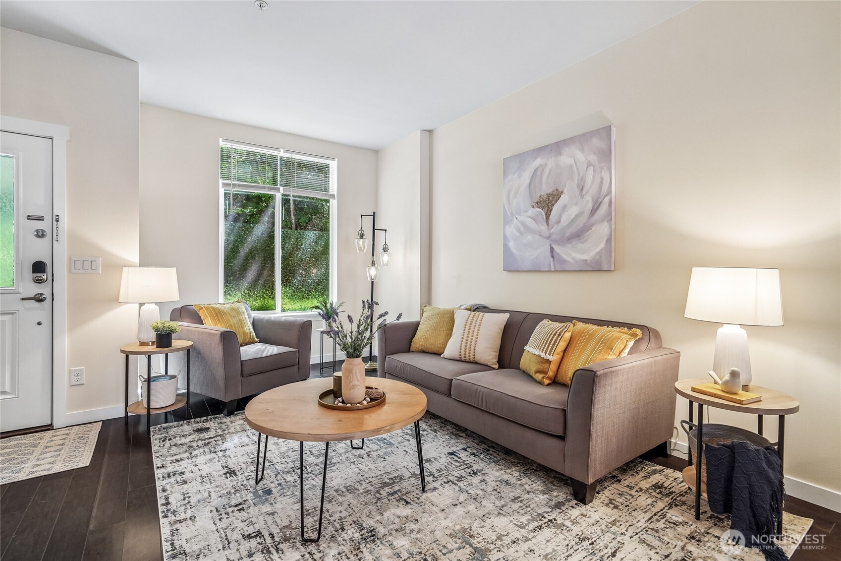 Welcome to this beautifully updated townhome in the highly desirable Talus community, where modern comfort meets unbeatable convenience. The bright, open-concept main level is designed for both everyday living and entertaining, featuring a spacious Great Room, rich hardwood floors, and a thoughtfully designed kitchen with stainless steel appliances, a full-size pantry, generous counter space, and abundant storage. Major appliances were replaced in 2024, providing peace of mind and modern efficiency. Fresh interior paint and newer carpet throughout the stairs, upper hallway, and bedrooms create a move-in-ready feel. Upstairs, you’ll find comfortable living spaces, two full bathrooms, and a functional layout designed for today’s lifestyle. A convenient main-level powder room is perfect for guests, while the lower level offers direct access to an oversized two-car garage. Step outside and enjoy everything Talus has to offer—miles of scenic trails right outside your door, a neighborhood café just across the street, and easy access to shopping, dining, Costco, and I-90 for a seamless commute. Move-in ready, thoughtfully updated, and perfectly located—this is Pacific Northwest living at its best!