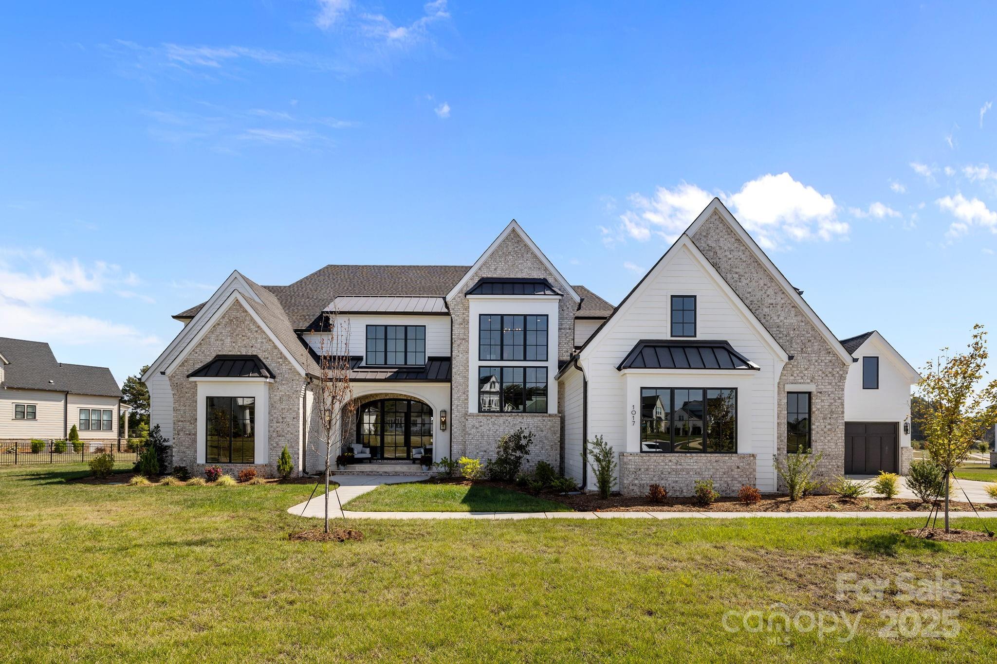 Experience refined luxury in this exceptional 5-bedroom, 5.1-bath residence located in one of the area’s most sought-after communities, served by the highly desirable Marvin school district. As one of the last opportunities to become part of this distinguished neighborhood, this home offers a rare chance to secure your place in a premier setting.Thoughtfully designed for both elegant entertaining and everyday living, the open and airy floorplan seamlessly blends indoor and outdoor spaces. Expansive living areas flow effortlessly to a stunning limestone rear lanai, creating the perfect setting for gatherings or quiet evenings overlooking the expansive yard. The first-floor primary suite provides a private retreat with convenience and sophistication, while each additional bedroom offering generous accommodations.Ideally positioned for executive relocation buyers, this residence offers effortless access to top-tier medical facilities, upscale shopping, fine dining, and Charlotte Douglas International Airport—ensuring both lifestyle excellence and travel convenience. Combining location, design, and exclusivity, this home represents luxury living at its finest.