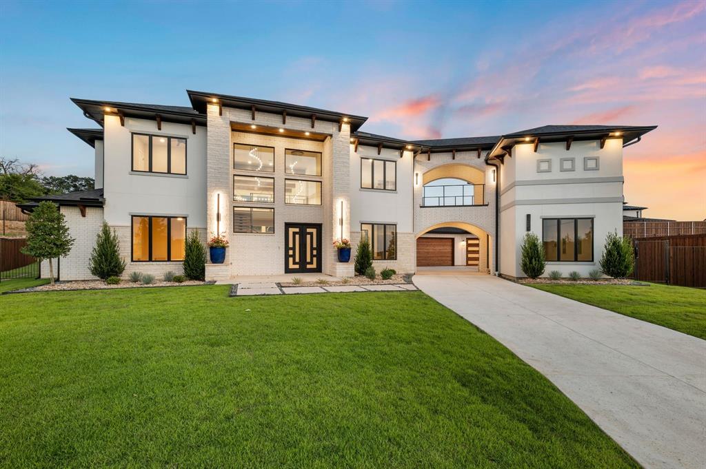 Welcome to a stunning new construction by BC Homes—where timeless elegance meets cutting-edge functionality in this modern Mediterranean masterpiece. Thoughtfully curated and flawlessly executed, this home combines warmth, luxury, and clean architectural lines for a sophisticated living experience.
The spa-inspired primary bath offers a serene retreat, complete with a zero-entry wet room that seamlessly flows between the oversized shower and soaking tub. Dual handhelds and dry towel storage add convenience to this beautifully appointed space.
Designed for entertaining and everyday luxury, the chef’s kitchen showcases Wolf and Sub-Zero appliances, a striking waterfall quartzite island, and a fully equipped butler’s pantry—perfect for hosting with ease.
Modern smart home living includes WiFi-enabled systems to control four HVAC zones and garage doors, along with a top-of-the-line Rinnai tankless hot water system delivering endless hot water on demand.
Built for high performance and sustainability, the home features full foam encapsulation, energy-efficient “heat-as-needed” water delivery, and top rated HVAC systems—ensuring year-round comfort with minimal environmental impact.
Finishes throughout are nothing short of exceptional: over 4,000 square feet of European white oak flooring, 700 square feet of split-faced stone tile, and artisan-crafted design elements that reflect the highest standard of construction.
Architectural drama abounds with soaring ceilings—22 feet in the foyer and great room, 13 feet in the primary suite, and 12 feet through the kitchen and dining—creating a grand yet inviting atmosphere in every corner of the home.
This is not just a new build—it’s a modern Mediterranean masterpiece tailored for the discerning buyer. 100k Pool allowance with full price offer