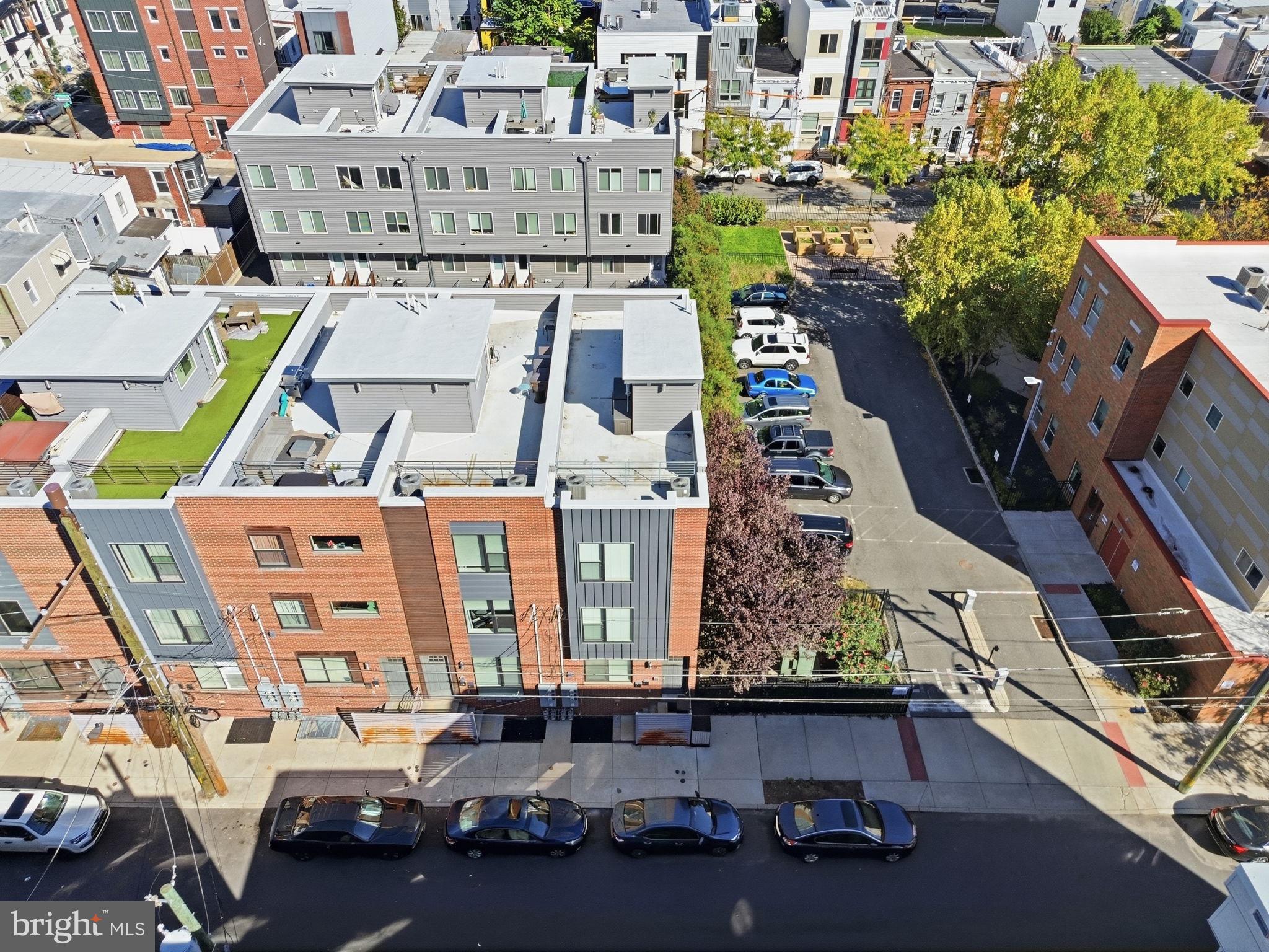 Welcome to this wonderful opportunity in East Kensington! Just on the border of Fishtown, this striking end-unit townhome brings together contemporary design, an inviting open layout, and the kind of outdoor space that makes city living special. Built in 2017, this three-bedroom, three-full-bath home offers multiple levels of thoughtfully designed living space, with natural light, bright finishes, and beautiful hardwood floors creating a warm and airy atmosphere throughout. Step inside and you’re welcomed into an open-concept first floor made for gathering. The living and dining areas flow effortlessly together, giving you plenty of room to unwind, entertain, and enjoy everyday life. At the heart of it all is the chef’s kitchen, featuring upgraded appliances and an upgraded oven vent with a 6-inch exhaust. Whether you’re preparing a quiet dinner at home or hosting a full house, this space is ready for it all. A first-floor bedroom and dedicated full bathroom add versatility to the layout, offering a comfortable option for guests, a home office, or whatever fits your lifestyle. Upstairs, the primary bedroom offers a private retreat complete with its own full bathroom. A third bedroom and additional full hall bathroom provide even more flexibility, while conveniently located hallway laundry keeps your daily routine simple. Designed for modern living, the home also includes a modern security system, hardwired surround sound system, and digital thermostat—thoughtful features that bring added comfort and convenience. Make your way upstairs to your own private deck and take in 360-degree views of the city. From morning coffee to sunset cocktails and evenings under the stars, this is the perfect place to relax, entertain, and enjoy the skyline from your own front-row seat. With its modern feel, light-filled interior, flexible layout, and rooftop views, this East Kensington home offers an exciting opportunity to enjoy city living in style. Come see it for yourself—you just might fall in love!