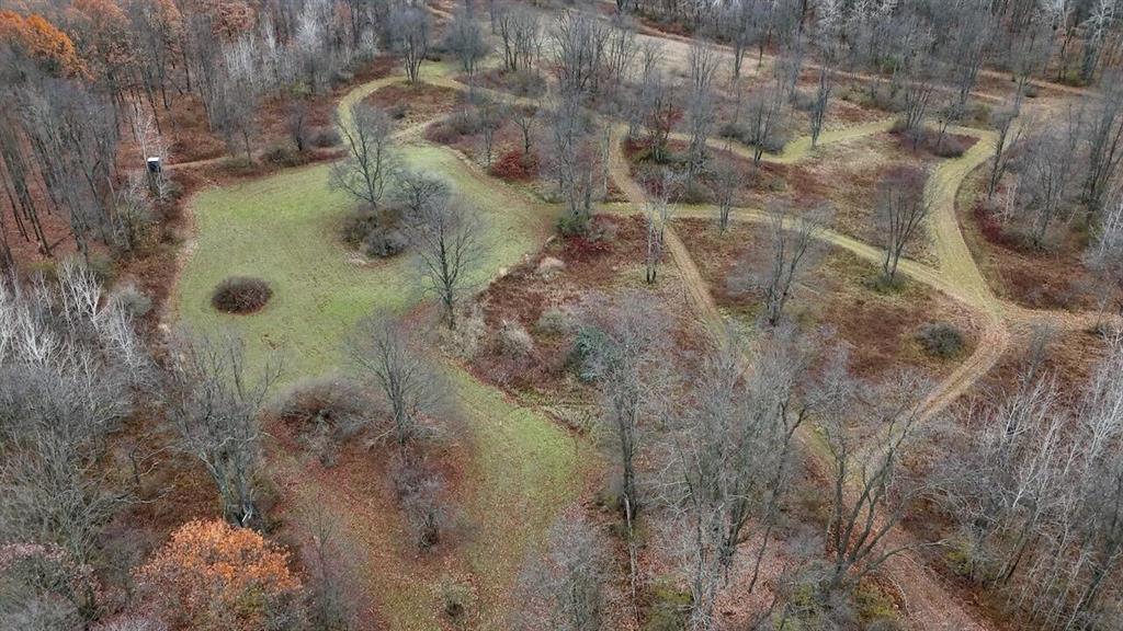Welcome to an exceptional 110?? acre hunting property in Clare County Michigan. An acreage that has been intentionally managed, carefully improved, and consistently producing quality deer and turkey opportunities. This tract has all the ingredients serious outdoorsmen look for: diverse habitat, proven whitetail history, established food sources, strategically designed access, and ideal bedding cover.  
 
The land features a balanced blend of mature hardwoods, scattered oak, and pockets of dense regeneration growth that create secure bedding areas capable of both holding and pulling deer throughout the season. The layout naturally funnels movement, while a network of planted trails and a manicured trail system allows for quiet, strategic access to nearly every corner of the property no matter the wind direction.  
 
Multiple established food plots are already in place, designed to draw deer during early season, pre-rut, and late winter periods. These plots are complemented by additional planted trails that serve as both travel corridors and supplemental food sources. Throughout the timber you'll find rubs, scrapes, heavy trails, and consistent deer sign, all confirming a long-standing pattern of mature buck activity.  
 
The western property line borders a well-managed private hunt club, adding even more stability to the neighborhood's deer age structure. This tract has a documented history of harvesting nice, mature whitetails, and trail camera photos support what this farm is capable of producing year after year. Turkey hunting is also strong, with roosting cover, edge habitat, and multiple open pockets ideal for calling and setups.  
 
Numerous tree stand and blind locations are already established, making this a true turnkey property ready to hunt on day one. Whether you're looking for a long-term hunting and recreation getaway or a high-quality property for an individual or group looking to own a prime hunting tract, this property actually checks every box. Call Chuck or Cody today to set up your own private  Current use is Hunting,Recreational.