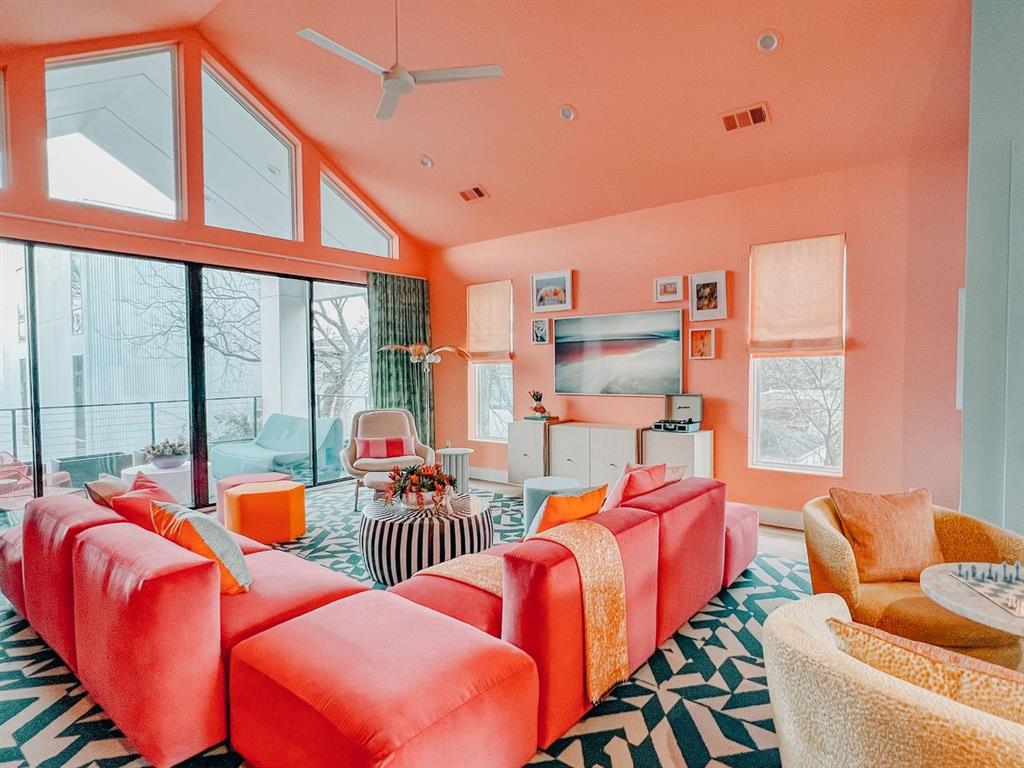 Bold design meets comfort and functionality in this East Village rizzler—formerly the popular Airbnb “Stay Love List,” designed in collaboration with award-winning Yates Desygn. This 3-bed, 2.5-bath home is filled with character, featuring a signature ombré stairwell, custom wallcoverings by Ever Atelier, and furnishings sourced from West Elm and CB2 and reupholstered in premium performance fabrics. The open-concept layout includes vaulted ceilings, expansive windows, and thoughtfully curated spaces throughout. Upstairs, enjoy a private patio with fireplace, perfect for entertaining or relaxing. The attached 2-car garage, small yard, and unbeatable location—just minutes from Uptown, Downtown, and Deep Ellum—add even more appeal. Whether used as a primary residence or an income-producing property, this home is a one-of-a-kind opportunity. Furniture available for purchase with the home.