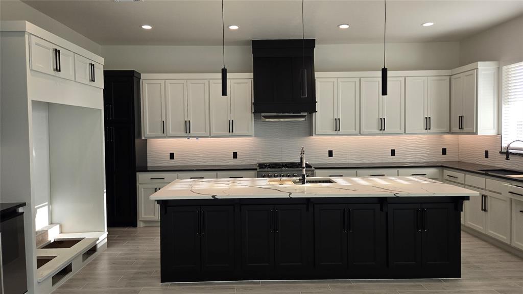 This exceptional new upscale modern design home offers a blend of luxury and functionality, featuring: Custom Cabinets: Tailored cabinetry that enhances both style and storage along with a study.• Forno Appliances: Equipped with Forno's Italian-inspired, professional-grade appliances, the kitchen.• Space-Saver Microwave: A built-in microwave designed.• Granite or Marble Countertops with Backsplash: High-quality stone countertops complemented by a matching backsplash, offering durability and timeless beauty. Ice maker installed so you don't have to worry about running out of ice. • Garage Door Opener with Keypad: An automated garage door system featuring a convenient keypad entry. • 2" Blinds on All Windows (Excluding Obscured Glass)• High-Efficiency 16 SEER Central Air-Conditioning: A 16 SEER central air-conditioning system that provides superior comfort and energy efficiency, ensuring a cool and comfortable living environment.• Fully Sodded Yard: A professionally landscaped yard with lush sod, creating an inviting outdoor space ready for enjoyment. Including a sprinkler system front and back. Along with covered patio so you can enjoy mornings or evenings comfortability. • Retractable Backdoor: A retractable backdoor that seamlessly connects indoor and outdoor living areas, perfect for entertaining and enjoying the outdoors.• Electric Fireplace: A modern electric fireplace that adds warmth and ambiance to the living space without the maintenance of traditional wood-burning options.• Exhaust Vent to the Exterior: An exhaust system that directs air outside, maintaining indoor air quality and comfort. This home is thoughtfully designed to offer a harmonious blend of luxury, functionality, and modern living. Garage door windows will be tinted. Future Owner can pick out carpet/flooring. Home is just minutes of I-35 or going East to I-240. Community has a pool and recreational center.