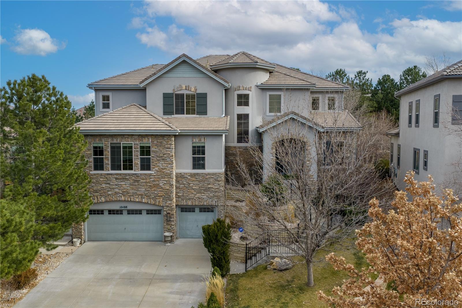 --------One of the best values along the Bluffs, Seller is motivated--------Set along Lone Tree’s protected open space, this modern luxury residence offers something increasingly rare: privacy, quiet, and scale ... all just minutes from trails, dining, and the Tech Center.From the moment you enter, the home feels expansive yet calm. Double height ceilings, wide Italian tile set over German acoustic underlayment, and walls of natural light create a space that looks grand but lives comfortably. The floor plan flows effortlessly, ideal for both everyday living and elevated entertaining.The kitchen anchors the home with clean lines, quality finishes, and seamless connection to the main living areas. The primary suite is a true retreat, featuring a private deck overlooking open space, a spa-inspired bath, and thoughtful separation from secondary bedrooms.Multiple living areas, a finished lower level, and flexible spaces throughout allow the home to adapt easily to today’s lifestyles; whether working from home, hosting guests, or creating a private fitness or media space.Outdoors, the home backs directly to open space and sits moments from the Bluffs Regional Park Trail, offering unmatched access to nature while remaining close to Park Meadows, Light Rail, and Sky Ridge.Seller is flexible and open to all strong offers. Easy to show and thoughtfully maintained, this is a rare opportunity to secure one of the best-positioned homes along the Bluffs at a compelling value under $2M.3D Walk-Through available on Homes.com