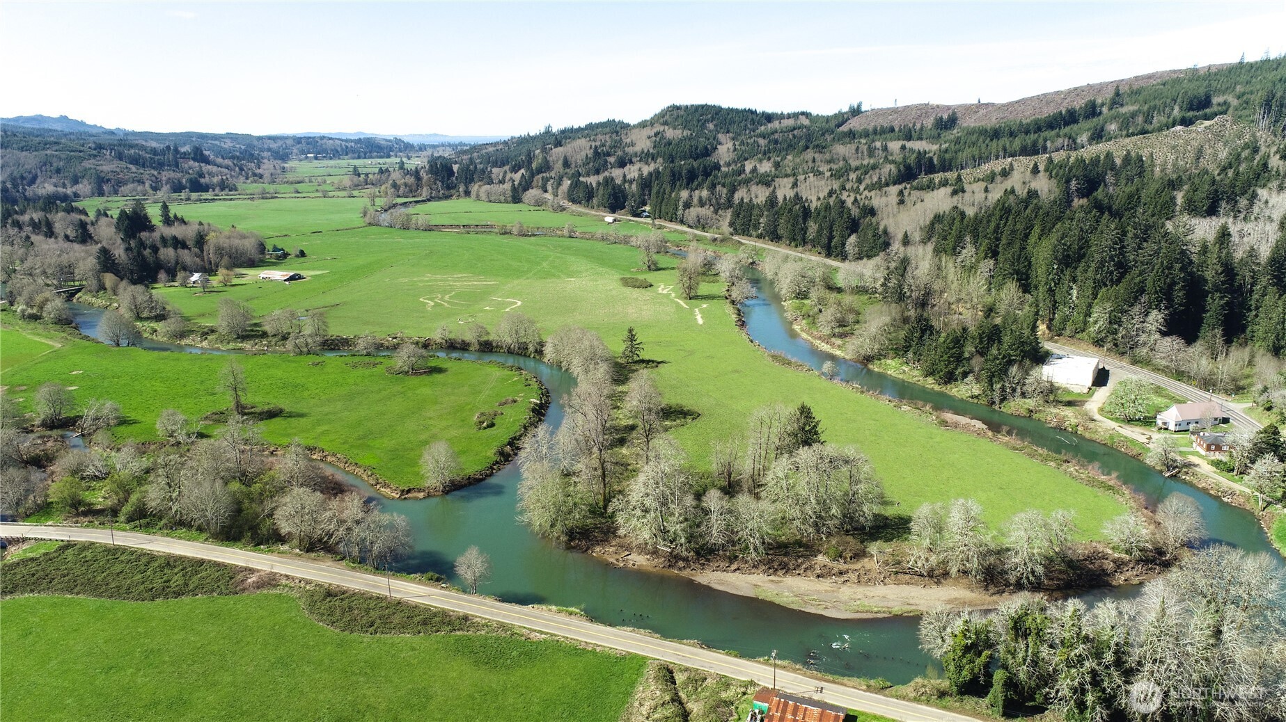Live the amazing life only a farm on a river can provide! Remodeled farm home on 69.39 level acres with 7,000 feet on the peaceful Grays River. Pristine home boasting 3 bdrm, 2 bthrm, open concept living w/walls of windows to take in the panoramic views, living rm w/wood stove & slider to covered deck, spacious kitchen w/eating bar & tongue & groove pine ceiling, dining rm, custom staircase to primary bdrm -3/4 bthrm-skylights-viewing deck, den/office, pantry/utility rm, crafts/exercise rm, ductless heat pump, vinyl windows, 806 SF attached garage/shop & 1 car carport. The grounds feature a 60x100 barn-shop-hanger, a 1,000 foot turf air strip w/taxi way, pastures, fruit trees & gardens. Additional home on the property w/remodel potential.