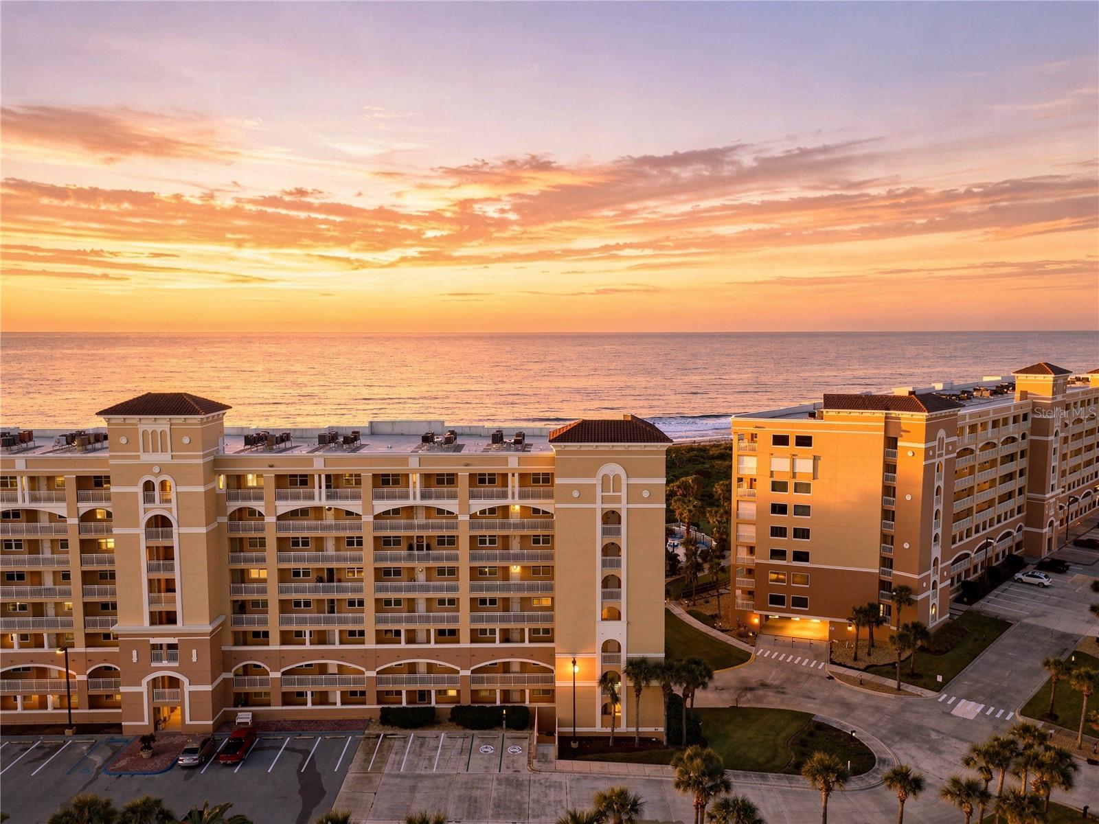 What if your day began with the sun rising over the ocean?Welcome to Surf Club II, where this coveted fifth-floor end unit pairs southern exposure with beautiful natural light and sweeping views of the ocean and beach, bringing the coastal setting into everyday life.Completely transformed through an extensive 2025 renovation, the interior is refined and distinctly coastal. The beautifully redesigned kitchen features new cabinetry and countertops, along with new appliances including a GE Café induction and convection range, under-counter microwave, refrigerator, and cabinet-front Bosch dishwasher. Luxury vinyl plank flooring flows throughout the residence, while both bathrooms have been fully renovated with new tile, showers, vanities, countertops, fixtures, and finishes. Updated lighting and thoughtfully selected details complete the transformation, while a newer HVAC system installed in 2022 adds another meaningful improvement.Then there are the views.Imagine beginning the day with the sun rising over the ocean, the beach below, and the changing colors of the Atlantic filling the horizon. It is a view that never feels ordinary—and one of the defining advantages of this southern end-unit location.The building offers elevator access to the fifth floor and parking within the building’s garage. At Surf Club, the experience extends well beyond the residence with direct beach access, three heated pools, a hot tub, fitness center, tennis and pickleball courts, clubhouses, recreation areas, and Intracoastal amenities. From the ocean to the Intracoastal, there is no shortage of ways to enjoy life along the water.And the location may be just as compelling. Set along the Hammock coastline between Flagler Beach and historic St. Augustine, this stretch of Northeast Florida is known for its natural beauty and relaxed coastal character. Local restaurants, shopping, and golf at Hammock Beach Resort are nearby, while the future Ritz-Carlton Residences at Hammock Dunes bring another notable addition to the area.Morning sunrises by the ocean. Afternoons by the pool. Evenings taking in the sunset over the Intracoastal.Beautifully renovated, wonderfully positioned, and surrounded by the best of coastal Florida, this is more than an opportunity to own at Surf Club II. It is an opportunity to experience why this particular residence stands apart.