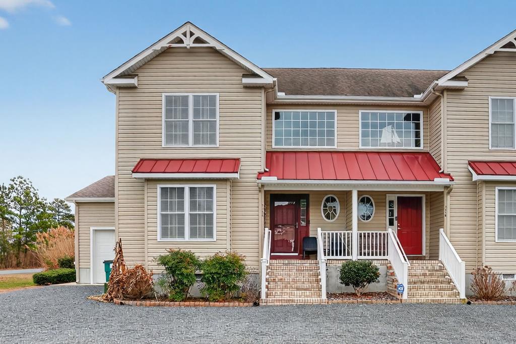 Wake up to waterfront island living on Chincoteague! This canal-front duplex, minutes from the Carnival Grounds, is turnkey and fully furnished. Offering 3 bedrooms, 2.5 baths, a first-floor primary suite, and a dramatic two-story foyer with vaulted ceilings, this light-filled home features hardwood floors, stainless steel appliances, and a breakfast bar. A main-level media room/office adds flexible living space. Enjoy multiple decks and a large 4 seasons room with peaceful canal and marshland views. Includes excellent storage with a mudroom/pantry and garage, owned solar panels, and a whole-house generator for energy savings and peace of mind. Community pool. Close to Assateague Island, shops, and dining. Septic rated for 2 bedrooms; county records reflect 3.