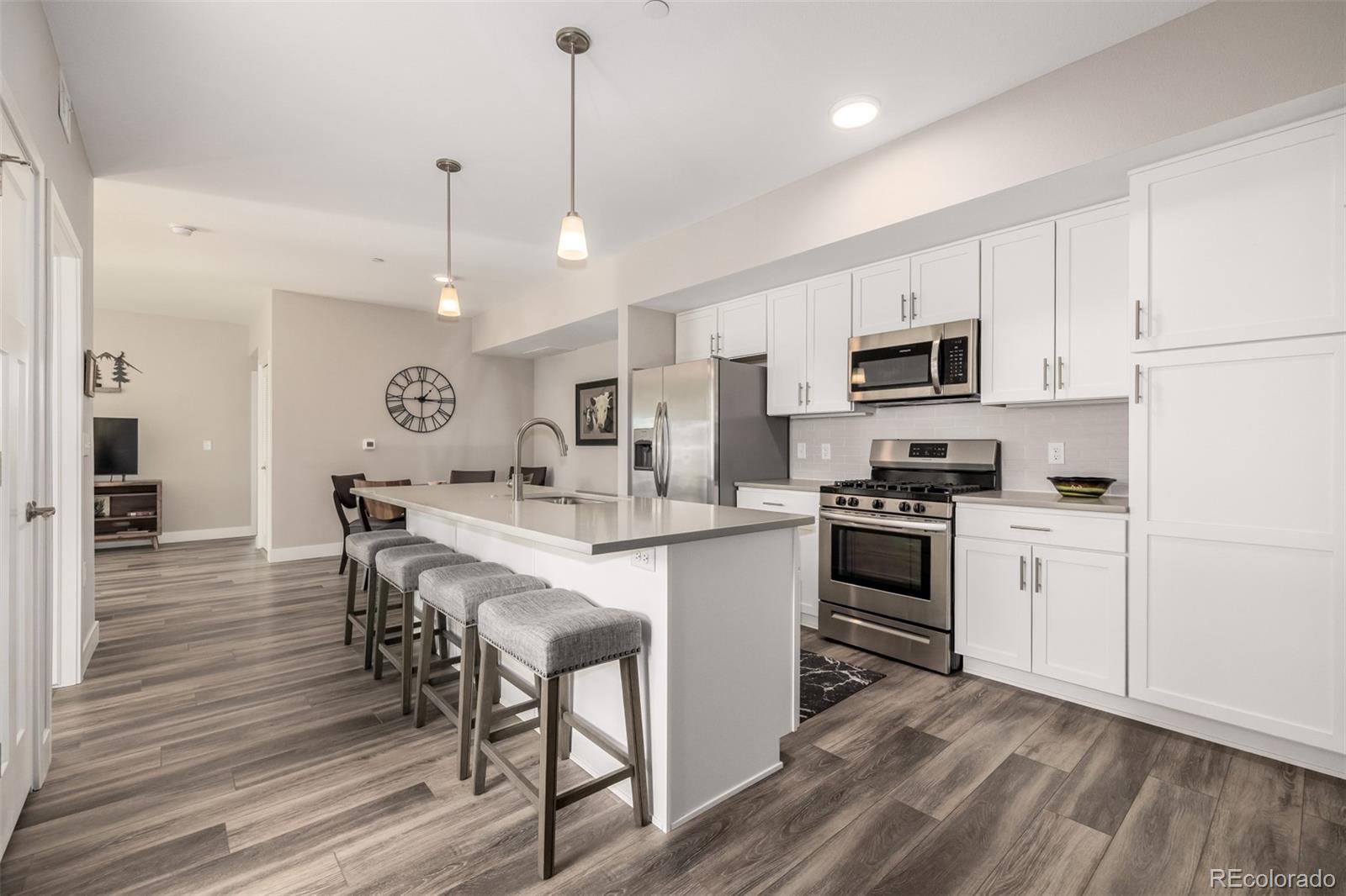 Light, mountain views, and effortless Lafayette living come together at 210 S Cherrywood Drive #204. This move-in-ready 2 bed / 2 bath condo is a bright southwest-facing end unit with an open layout, lots of windows, and a private balcony made for morning coffee and Colorado sunsets. The primary suite includes a private bath, while the flexible second bedroom works equally well for guests, a home office, or both. Everyday convenience is covered with elevator access, in-unit laundry, secured entry, a detached 1 car garage, and nearby guest parking. Cherrywood residents also enjoy a private dog park, grilling area, and bocce ball court. When it’s time to get out, Coal Creek Trail is just minutes away, and the restaurants, breweries, coffee shops, and year-round events of Old Town Lafayette are only a little over a mile from home. With easy access to Boulder, Louisville, shopping, and commuter routes, this is low-maintenance Boulder County living in all the right ways. Furnishings are negotiable.