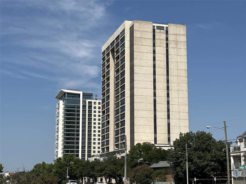Welcome to the Athena, a full-service high-rise condominium and distinguished luxury landmark. Unit #918 offers a sweeping 180-degree south-facing view of Park Cities with the Downtown Dallas Skyline as a backdrop. This custom unit features two spacious bedrooms, two and a half bathrooms, two expansive living areas complete with a classic bar, two dining spaces and a laundry area. Extensive custom built-ins, cabinetry and closets provide exceptional storage throughout. The building is conveniently located near retail centers, restaurants, Park Cities, and downtown Dallas. The Athena maintains a smoke-free environment and does not permit pets. HOA dues cover comprehensive utilities, plus internet and WiFi access throughout the property, cable television, security, concierge staff, grand lobby, assigned garage parking and storage unit, gym facilities, a large indoor heated saltwater pool, entertainment rooms, and additional amenities. This prized unit offers tranquil living and impressive views, particularly at sunset.