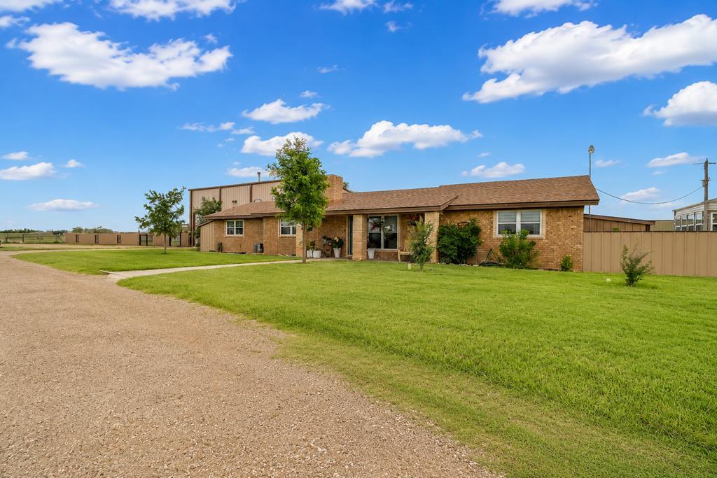 Incredible property! This beautifully updated 3BD/2BA country home on 11.6 acres has it all! Features include a sequestered primary suite with a huge walk-in closet, updated kitchen and bathrooms, and a 2-year-old roof. Has a detached 1,865 sq. ft. 4-car shop, 900 sq. ft. of heated/cooled game room or guest space. Greenhouse with water and electricity! Separate fenced area for animals with pens. Plus a chicken coop. Enjoy two covered patios, a 12-ft privacy fence along the back, and peaceful country living with room to grow. Shooting range! Room to play!