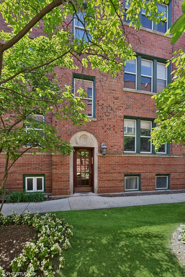 Beautiful Lincoln Park 2 bedroom 1 bathroom penthouse condo in an amazing walk to everything location on one of the most desirable tree lined streets in Chicago. This sun-drenched condo has a split bedroom floorplan with hardwood flooring and spacious rooms. Upon entering, welcome guests into your formal foyer which leads to the spacious living room which is generous enough to fit a separate dining space and features a gas log fireplace with a gorgeous stone surround and white mantel.  Just off the living room sits a large second bedroom which easily fits a queen sized bed and makes a great combo guest room/office. The roomy kitchen has lots of cabinet  space, stainless steel appliances and in-unit laundry with a full size washer/dryer. The spacious primary bedroom is filled with natural light and can easily accommodate a king bed and has a wall of closets. Adjacent to the primary bedroom is a full bath with granite vanity for additional storage. Off the kitchen is a private deck, ideal for entertaining, relaxing, or grilling. This unit comes with an extra storage room in the basement as well as Central AC. There are no onsite parking spaces, but there is easy permitted street parking as well as rental parking nearby. Cats and dogs welcomed.  Great reserves, building has been spot tuckpointed with roof repairs done in the last 5 years and checked regularly, and building water heater new in 2025. Windows all from 2020 or 2025 so less than 5 years old. The building is currently 100% owner occupied but does allow rentals.  Ideal Lincoln Park location across from Oz Park, short walk to Fullerton red, purple and brown line trains, short walk to Lincoln Park Zoo and everything you love about Lincoln Park including shops, restaurants, and the Lake. In the desirable, top ranked Lincoln Elementary and Lincoln Park High School districts.   Updates galore: Furnace and AC unit are less than 4 years old. Washer/dryer only 4 years old.  Fridge and microwave less than 1 year old. Xfinity internet, Xfinity cable, water, trash and professional snow removal included in the HOA fee. Owner only pays gas and electric.