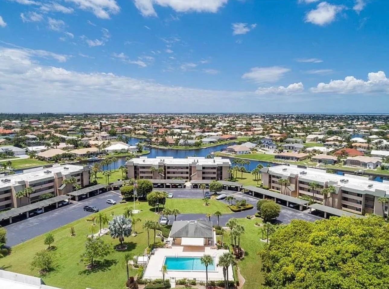 This exceptional waterfront condo in the highly desirable Banyan Point community offers a rare combination of sophisticated style, comfort, and the quintessential Punta Gorda lifestyle. Beautifully appointed and turnkey furnished, this 2-bedroom, 2-bath residence offers more than 1,398 square feet of bright, open living space and feels like it belongs in the pages of Architectural Digest. The thoughtfully designed open-concept floor plan features neutral décor and sleek tile flooring throughout, creating an elegant yet comfortable atmosphere. The beautifully updated kitchen is a true centerpiece, showcasing crisp white cabinetry, granite countertops, and a generous breakfast bar—perfect for casual dining or entertaining. The spacious living and dining areas are filled with natural light and open through sliding glass doors to an expansive screened lanai. With versatile  sliding glass doors on the lanai, it can be enjoyed throughout the year while offering a comfortable space for morning coffee, relaxing evenings, or dining with friends as you take in the exceptional intersecting canal views.The generously sized primary suite is a peaceful retreat, featuring direct access to the lanai, a large walk-in closet, and a private ensuite bath with dual vanities and a luxurious walk-in shower. A desirable split-bedroom floor plan provides privacy for guests, with a spacious second bedroom and beautifully appointed full bath. For boating enthusiasts, Banyan Point offers an incredible waterfront lifestyle with assigned boat docks accommodating boats up to 50 feet, providing quick and convenient access to open water. The community also features a beautiful waterfront pool, heated during the cooler months and chilled during the summer for year-round enjoyment. Located within Punta Gorda Isles, residents also have the opportunity to join the Punta Gorda Isles Civic Association (PGICA), a vibrant social destination offering more than 40 special-interest clubs, fitness classes, educational programs, entertainment, and community activities (membership fee applies). And the location is truly exceptional. Enjoy being within easy walking or biking distance of historic downtown Punta Gorda, Fishermen’s Village, waterfront dining, boutique shopping, parks, walking and biking trails, farmers markets, and an array of local events and entertainment. Whether you're looking for a full-time residence, seasonal escape, or waterfront investment, this beautifully furnished Banyan Point condo delivers the best of the Punta Gorda lifestyle—waterfront living, boating, resort-style amenities, and a premier location. Move-in ready and truly special, this is waterfront living at its finest. Schedule your private showing today!