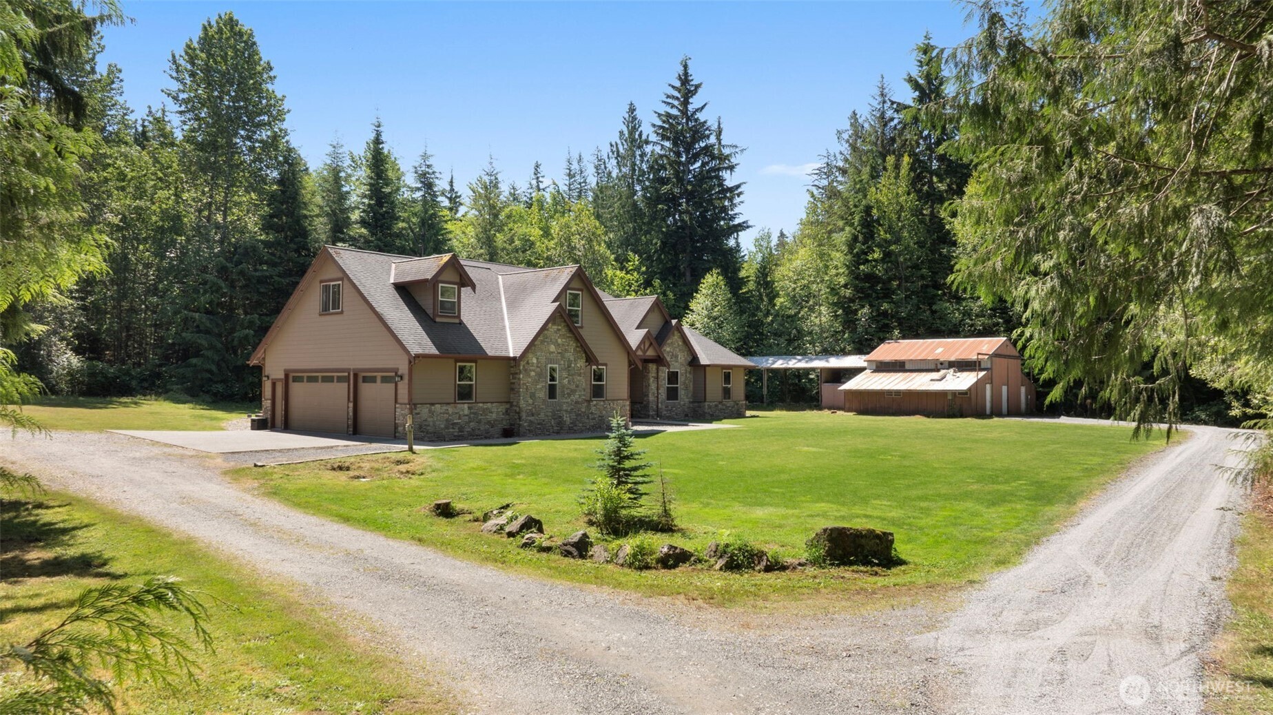 No blinds needed and expectations exceeded on this 5-acre parcel in Arlington, featuring a gorgeous 2012 home with an attached 6-car garage, perfect for collectors, mechanics, or anyone who needs serious workspace. The home itself has NEW luxury vinyl plank flooring, a spacious layout, a formal dining room, abundant storage, and closets. Surrounded by native growth, it feels like living in a park with everything you need on ONE level and the added bonus of EPIC ENTERTAINMENT SPACE UPSTAIRS! Perfect for entertaining or creating your dream hangout. Last but not least, is the BARN, which, with power, plumbing, and MIL potential, will be of particular interest to the aspiring Homesteader. This home has SO MUCH to offer. All just mins from town!