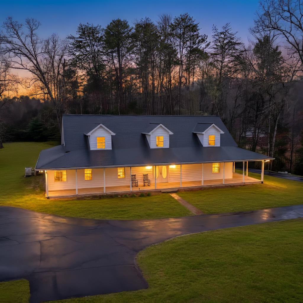 With its classic farmhouse exterior, wide porches, and open yard, this home makes a strong first impression—and once you step inside, the scale of the space really stands out. The word that keeps coming to mind here is oversized, and it shows up in all the right places. The heart of the home is a spacious open kitchen and living area designed for gathering. An extra-large kitchen island anchors the space, giving you plenty of room for cooking, casual meals, or hosting friends and family. There's generous pantry storage, abundant cabinetry, and room to move without feeling crowded. The primary suite is comfortably oversized, complete with a walk-in closet, while the second bedroom stretches the full length of the home, offering flexibility for guests, shared sleeping space, or hobbies. A dedicated office on the main level makes working from home easy without sacrificing living space. Practical features make everyday life smoother, including a true laundry room with a utility sink and workspace—no cramped laundry closet here. The oversized garage provides room for vehicles, tools, and outdoor equipment, and there's additional storage upstairs for seasonal or long-term needs. Set on 3.07 acres of gentle, usable terrain, the land offers excellent sun exposure for gardening, blueberry bushes, or simply enjoying open space. The front and back porches create natural spots to relax, entertain, or take in the peaceful surroundings. If you've been looking for a home that offers room to spread out—inside and out—this farmhouse-style property delivers space, function, and comfort in a quiet Marble setting and NO HOA.
