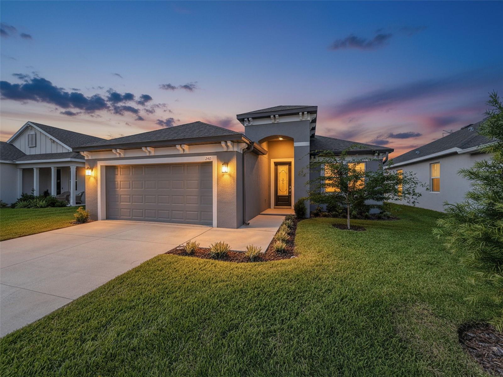 This meticulously appointed, ONE-YEAR-OLD home is situated in the highly sought-after North Lake Trail community. Nestled alongside the scenic Pinellas Trail, you’ll enjoy a short bike ride to the charming historic downtown district and the renowned Sponge Docks.
Step inside to discover an inviting ambiance highlighted by tasteful upgrades throughout. The bright and airy living spaces feature recessed lighting, crown molding and generous ceiling height.  Luxury vinyl plank flooring flows seamlessly through the living areas, while plush carpeting adds comfort to the bedrooms.
The primary suite is a true retreat, complete with a spacious step-in shower, a double vanity for added convenience, and a roomy walk-in closet. Two additional bedrooms share a well-appointed bathroom, ensuring comfort and privacy for family or guests.
Culinary enthusiasts will love the kitchen, which boasts high, soft- close cabinets, a walk-in pantry, and sleek stainless steel appliances complemented by stunning granite countertops. The large breakfast nook provides direct patio access, perfect for enjoying your morning coffee or entertaining guests.
Additionally, a separate dining room/office offers ample space for family gatherings or a peaceful workspace, making it ideal for today’s lifestyle. The sizable laundry room includes a convenient folding cabinet and an extra-large closet, providing plenty of storage solutions.
Don’t miss your chance to call this beautifully upgraded home your own in a community that perfectly blends convenience and charm!