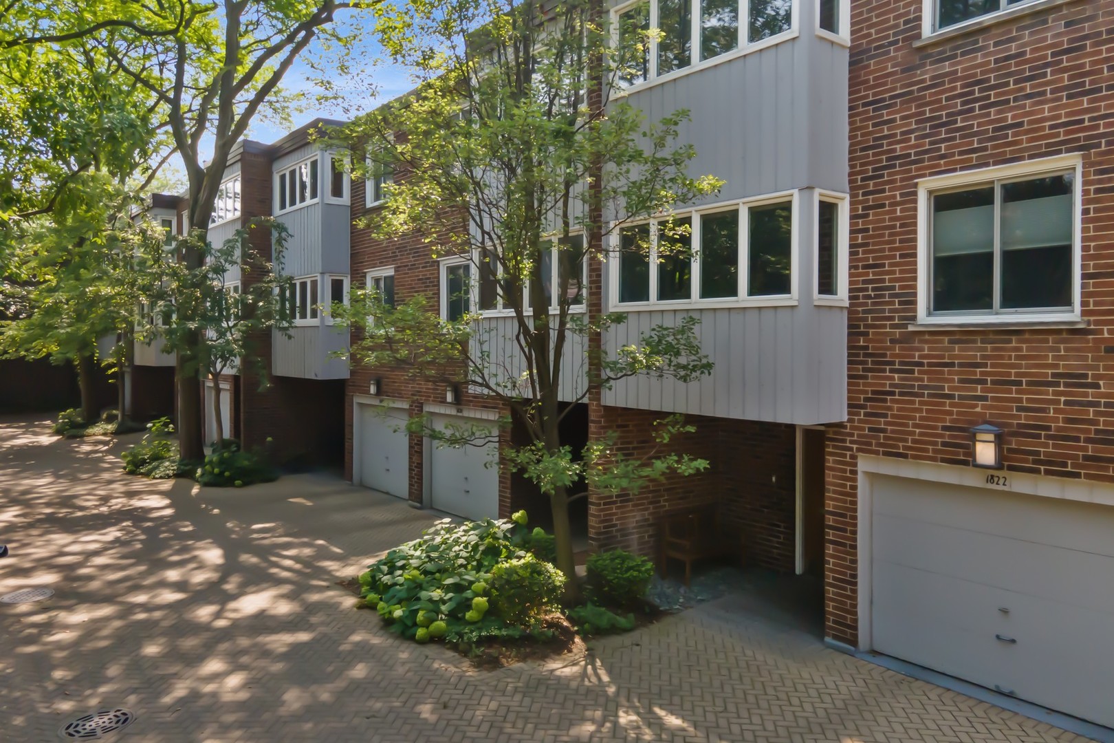 Located in the heart of Old Town/Lincoln Park, tucked away within a private courtyard, this rarely available sun-filled three bedroom + den townhome offers a great floor plan, a large private patio overlooking Ogden Park and an attached garage with good storage. The entry level features a spacious den/family room, walk-in closet, laundry room, and direct access to a private terrace that opens to lush green space and a playground. The main level is ideal for entertaining, featuring a generous living room with a gorgeous marble WBFP with a gas starter, custom built-ins, separate dining room, eat-in kitchen with walk-in pantry, and a convenient powder room. Upstairs, three well-sized bedrooms complete the home, including a primary suite with a large walk-in closet. Beautifully maintained by the original owners, this home is perfectly positioned within walking distance to the lake, Lincoln Park Zoo, farmers markets, Oz Park, Armitage shops, public transit, and some of the city's best dining. Located in the highly sought-after Lincoln School District!
