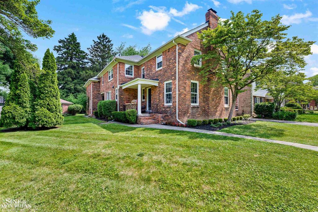 A Stately Grosse Pointe Farms Classic with Rare Bonus lot. Timeless elegance and unbeatable location define this 1929 brick colonial nestled on one of the Farms' most desirable tree-lined streets. With nearly 3,000 square feet of living space, this home sits on a rare double lot-offering incredible green space, privacy, and room to stretch out in a way that's hard to find in Grosse Pointe. Inside, you'll find rich hardwood floors, original architectural details, and beautifully scaled rooms bathed in natural light from oversized windows. The traditional center-entrance layout includes a gracious foyer, large living room with fireplace, formal dining room, and a charming sunroom perfect for morning coffee or evening unwinding. The white kitchen features granite counters, abundant cabinetry, and a center island with butcher block top-offering a warm, functional space for everyday cooking and entertaining. A cozy breakfast nook adds casual dining appeal, and two generous living areas give flexibility for hosting, relaxing, or working from home. Upstairs, four spacious bedrooms offer classic charm and comfort, along with ample storage. The home's floor plan is wonderfully adaptable to changing needs, offering both elegance and ease for today's lifestyle. Outside, enjoy the perks of an extra lot-nicely landscaped, ideal for entertaining, gardening, or simply enjoying the serenity of your own outdoor oasis. Whether you use the bonus space as-is or explore its potential down the road, it's a true luxury in the Farms. Located just blocks from The Hill, top-rated schools, parks, and lakefront amenities, this home combines character, space, and location in one exceptional package. 276 Lewiston offers vintage charm, thoughtful updates, and a setting that's simply unmatched.  Also includes adjacent vacant lot known as Lot 5 Lewiston Road Sub PC 258 L62 p75 WCR Tax Parcel ID # 38-010-0005-000
