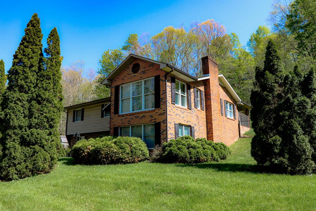 This well-maintained split-foyer brick home offers plenty of space and versatility, situated on a generous 0.92+/-acre lot. The upper level features beautiful hardwood floors, a spacious eat-in kitchen, and a large primary suite with a private full bath. The primary bedroom was originally two bedrooms and was thoughtfully combined to create an expansive retreat.  Enjoy cozy evenings by the upstairs fireplace, which can be used as either gas or wood-burning. Additional heating options include a stove hookup in the basement.   The lower level features a large family room, a full bath, and a bonus room that could easily serve as a third bedroom, home office, or hobby space.  Quality Anderson vinyl-clad windows with interior wood frames provide both beauty and energy efficiency throughout the home. With nearly an acre of land, this property offers plenty of outdoor space to enjoy while maintaining the convenience of a desirable split-foyer layout. There is also a full home generator and a fence to keep your fur babies safe outside.