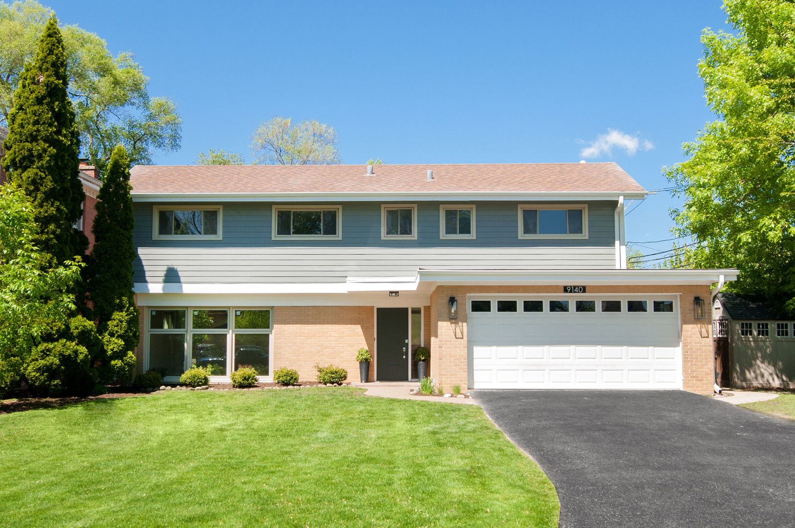 Welcome to 9140 Keystone Avenue, a contemporary haven located in the desirable Devonshire area. This beautiful home seamlessly blends modern aesthetics with everyday functionality across 2,579 square feet of luxurious living space. With four spacious bedrooms and three elegant bathrooms this residence is perfectly designed for those who appreciate style and comfort. As you enter you are greeted by an open-concept design that connects the living, dining and kitchen areas under soaring vaulted ceilings. A wall of windows floods the space with natural light and offers picturesque views of the expansive backyard. The gourmet kitchen is truly the heart of the home, featuring an expansive island, two dishwashers, state-of-the-art stainless steel appliances, quartzite countertops and custom cabinetry that offers both beauty and abundant storage. Throughout the home white oak hardwood floors exude warmth and sophistication. Recent upgrades include new windows and hardie board siding along with new gutters ensuring both modern aesthetics and energy efficiency. The full basement expands the living space further with a large family room complete with a fireplace, laundry facilities and ample storage. Step outside to enjoy your private outdoor retreat. The spacious patio is perfect for relaxation or entertaining set within a generous 8,976 square foot lot that offers plenty of opportunities for outdoor enjoyment. This move-in-ready home is a rare opportunity for modern living in a beautifully updated setting. Don't miss your chance to experience the comfort and sophistication of 9140 Keystone Avenue-schedule your visit today.