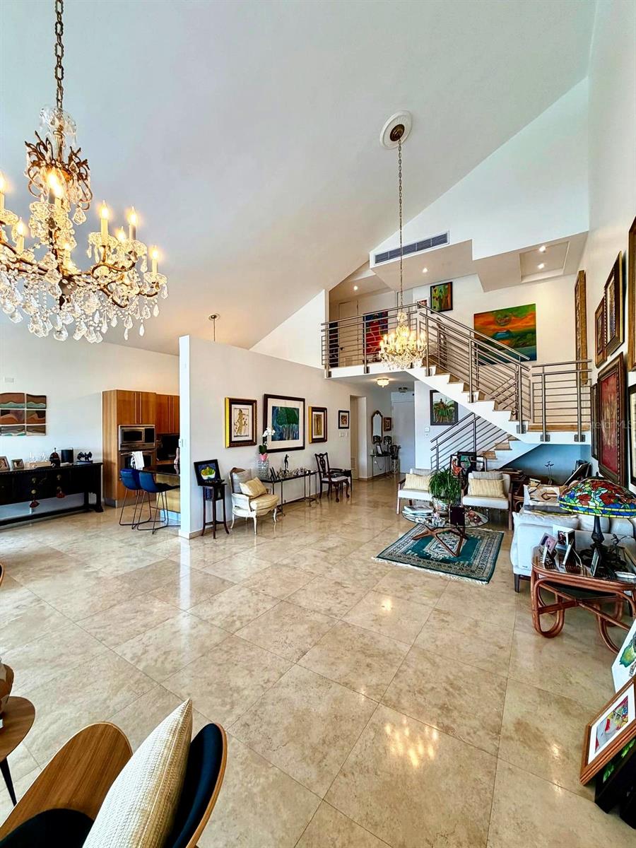 Rare opportunity to own the only true penthouse of its kind in Guaynabo. This magnificent two-level residence at Plaza del Prado occupies the 13th and 14th floors of Guaynabo's most unique luxury high-rise, offering 3,267 sq ft of refined living space plus an expansive ~490 sq ft private open terrace — where breathtaking 360° panoramic views and spectacular Caribbean sunsets unfold nightly. Soaring 22-foot cathedral ceilings, marble floors throughout, and an open-concept layout define this extraordinary home. Features 4 bedrooms, 3.5 baths, gourmet kitchen with granite countertops, and 4 covered parking spaces. Building amenities: 24/7 gated security, concierge & valet service, full backup generator, water cistern, swimming pool, two fitness centers, and gazebo. Minutes from Puerto Rico's finest private schools — Baldwin School, Colegio San Ignacio, Academia Maria Reina, Colegio Puertorriqueno de Ninas, Parkville School among others. Direct access via PR-177, PR-833 & Martínez Nadal Expwy. No comparable penthouse exists in Guaynabo.
