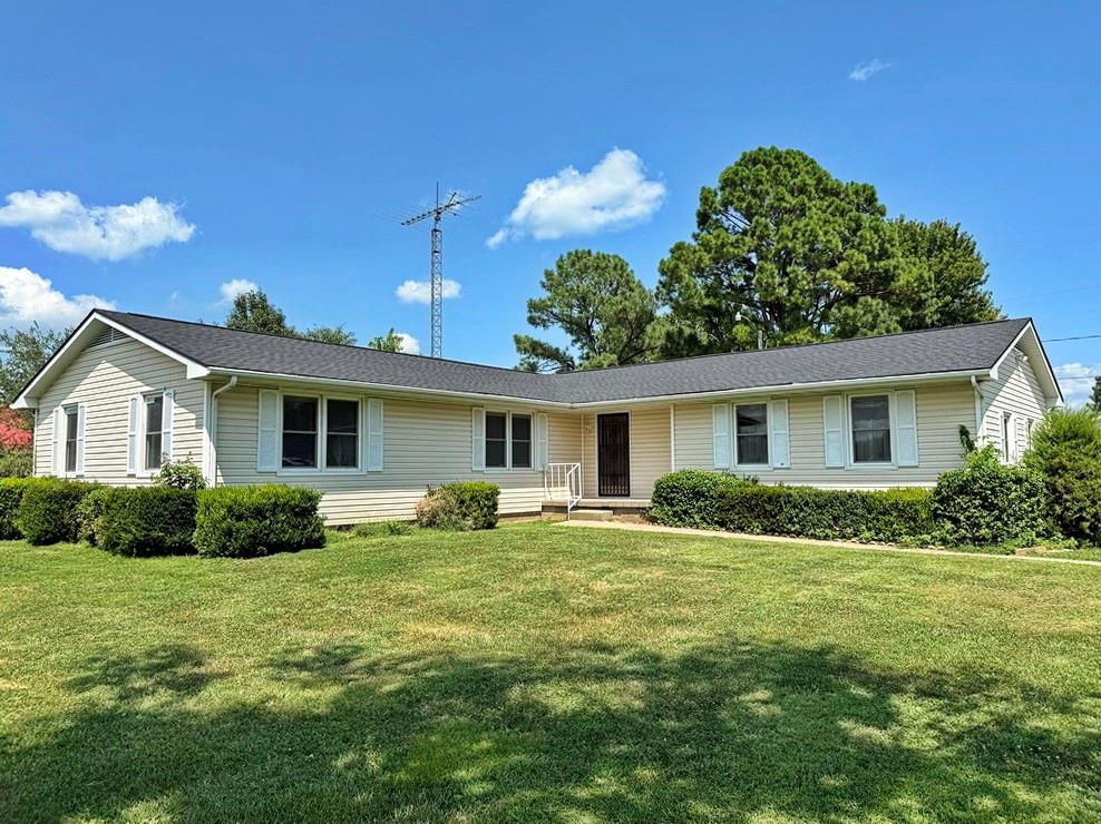 Spacious, Move-In Ready Home in a Prime El Dorado Springs Location.  Welcome home to this beautifully maintained 3-bedroom, 1.5-bath residence on thesouth side of El Dorado Springs, MO. Offering approximately 1,450 square feet ofcomfortable living space, this move-in ready property combines modern updates,generous outdoor space, and a location that’s hard to beat. Recent improvements include a brand-new roof and fresh interior paint, giving the homea clean, updated feel. The bedrooms feature beautiful hardwood flooring, andhardwood is also believed to be beneath much of the existing carpet in the home. A spacious 14’ x 23’ living room provides the perfect setting for entertainingfamily and friends or simply relaxing at home.Situated on an oversized 0.57-acre lot, the property offers plenty of room to enjoy theoutdoors. A large 10’ x 25’ deck overlooks the backyard that is enhanced by a whitevinyl fence along the east side and a privacy fence along the north, creating anattractive and functional outdoor setting.  A circle driveway provides easy street access and leads to an attached two-car garage for convenient parking. Two storage buildings offerexcellent space for lawn equipment, tools, or hobbies. Additional features include a built-in storm shelter in the garage, excellent closet space throughout the home, and a well-kept yard that reflects the pride of ownership found throughout the property.Located in a quiet, established neighborhood, this home is ideal for evening walks andbike rides while remaining just minutes from shopping, dining, medical facilities, andother everyday conveniences.If you’re looking for a well-maintained, move-in ready home with space, updates, and anoutstanding location, this El Dorado Springs property is one you won’t want to miss.