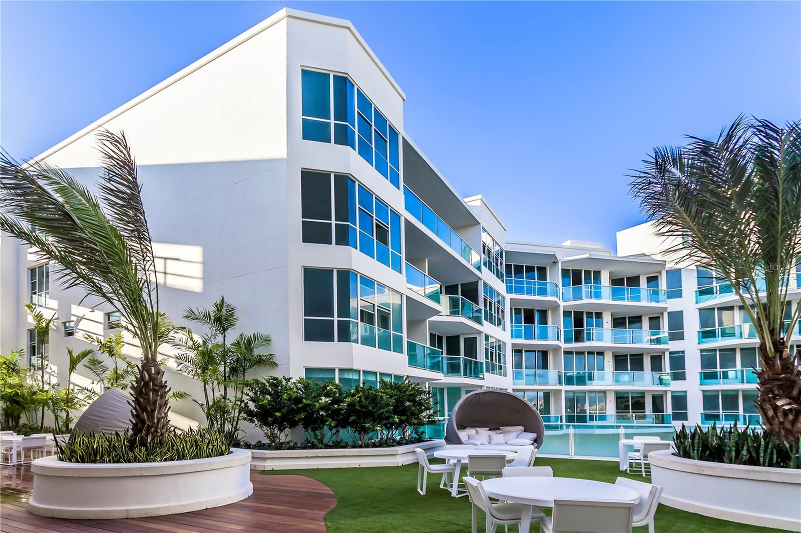 Welcome to 1,910 square feet of quiet elegance in Bahia Plaza, within Paseo Caribe.Two serene bedrooms.  Two and a half baths.  Generous living spaces designed for comfort, light, and effortless flow.Enjoy your morning coffee with lagoon and ocean breezes. Host intimate dinners that flow seamlessly from the kitchen into the living space. End the day with a sunset walk along the marina.This residence isn’t loud.   It doesn’t need to be.   It’s about ease.  Privacy.  Balance.The kind of lifestyle that feels curated — yet completely natural.  Where sophistication feels effortless… and living well becomes second nature.